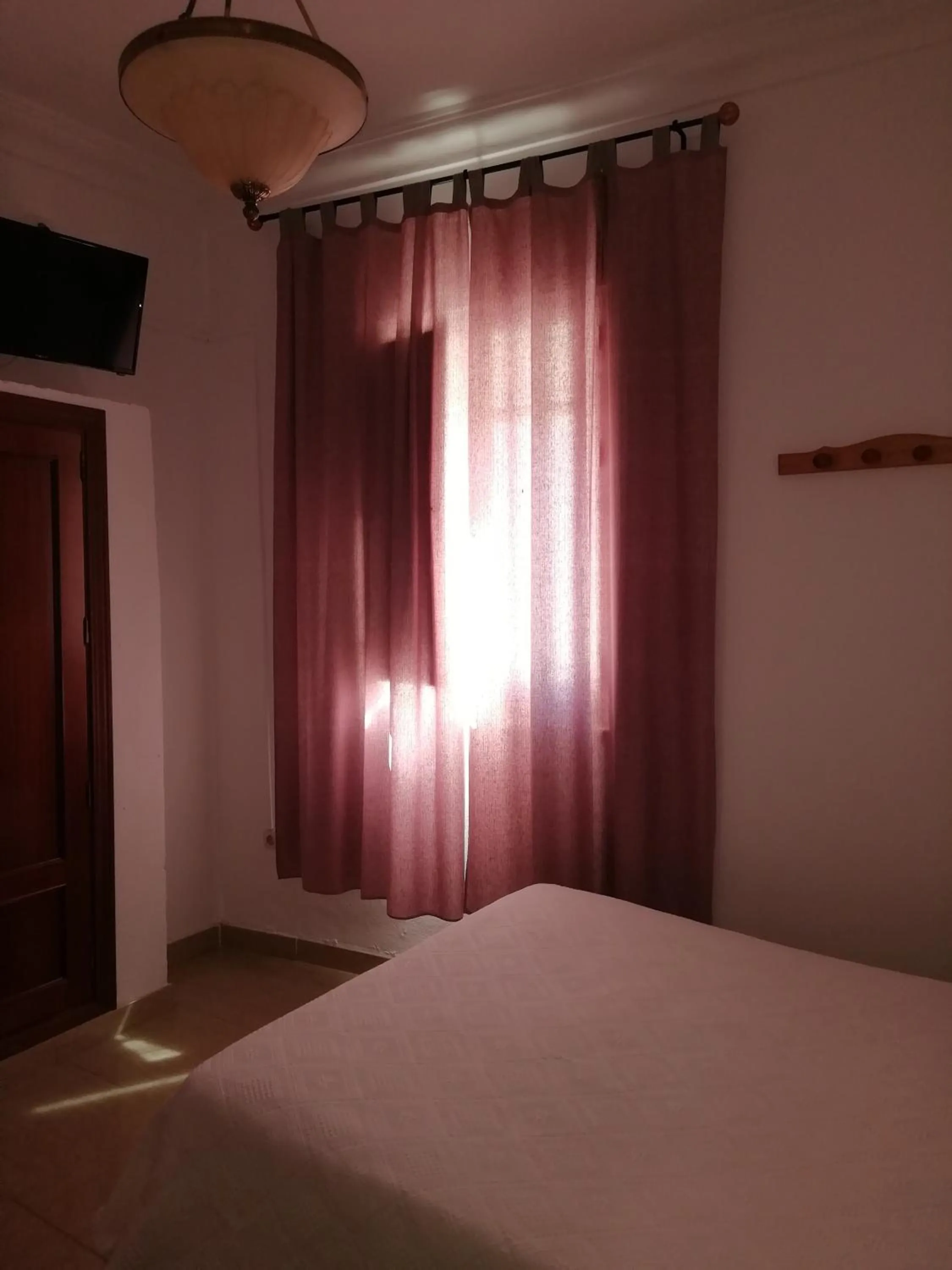 Bed in Hostal Sierpes