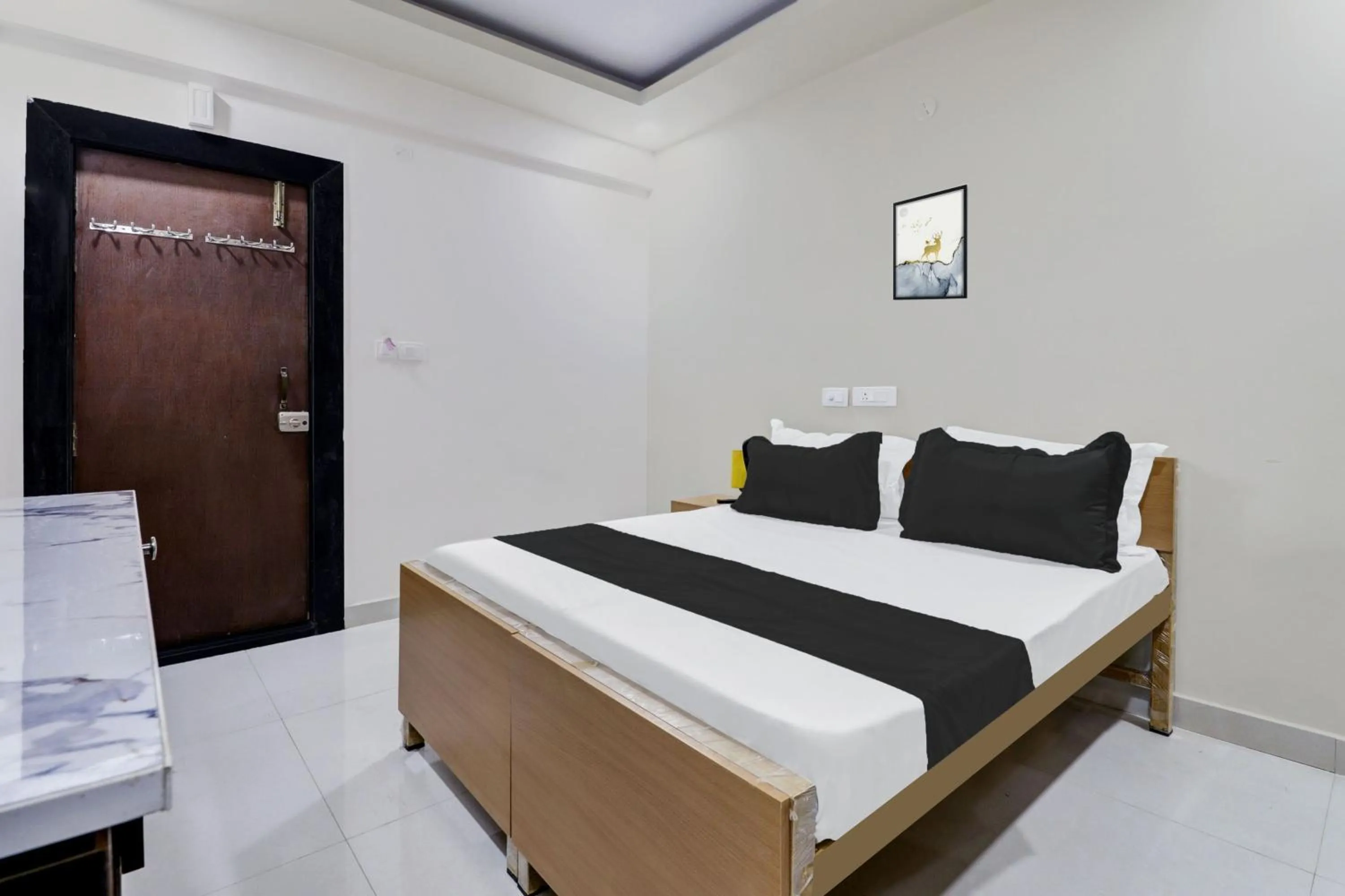 Bedroom in Hotel O Sri Harshitha Grand Near Zudio - Star Bazaar, Kundalhalli Gate