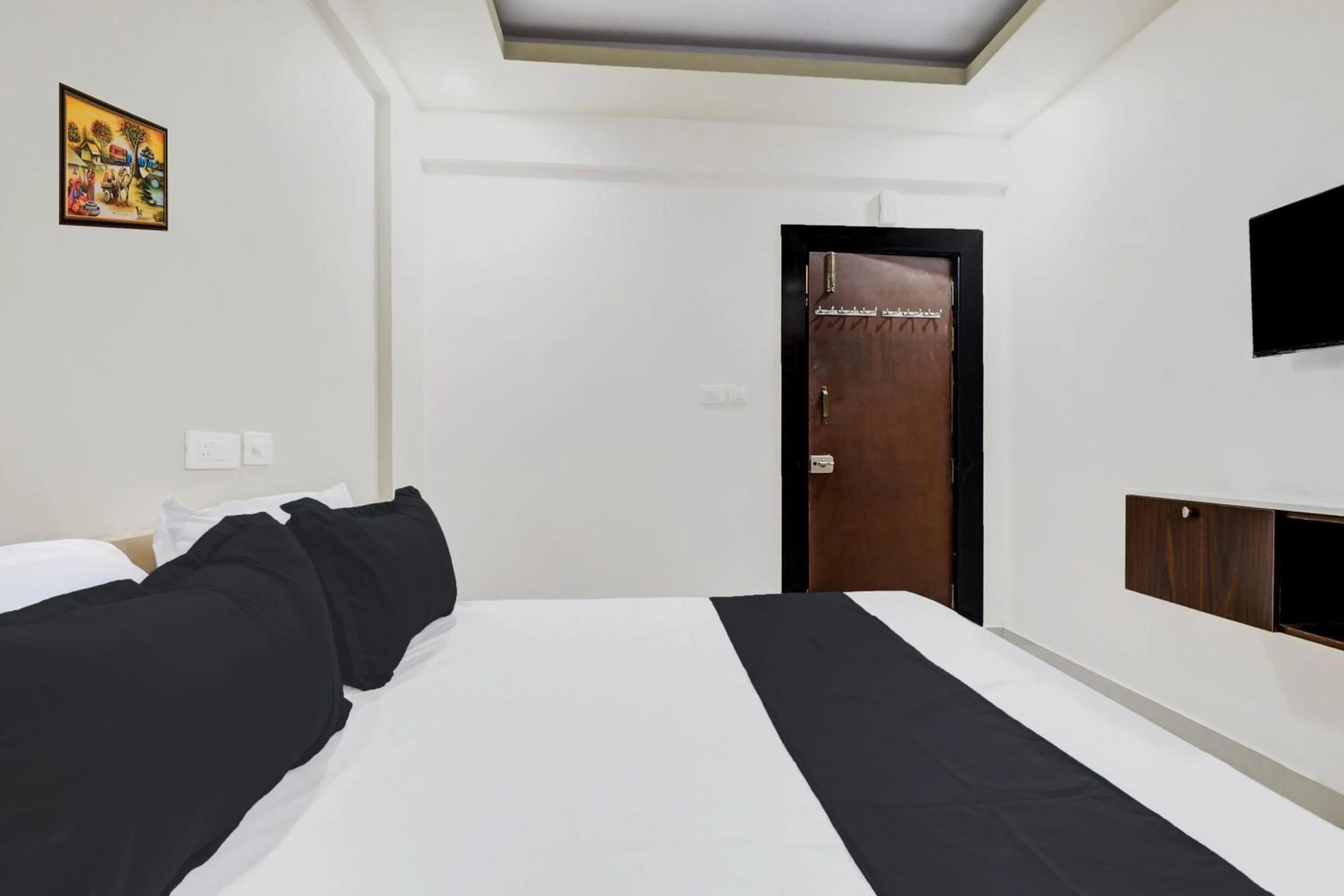 Bedroom in Hotel O Sri Harshitha Grand Near Zudio - Star Bazaar, Kundalhalli Gate