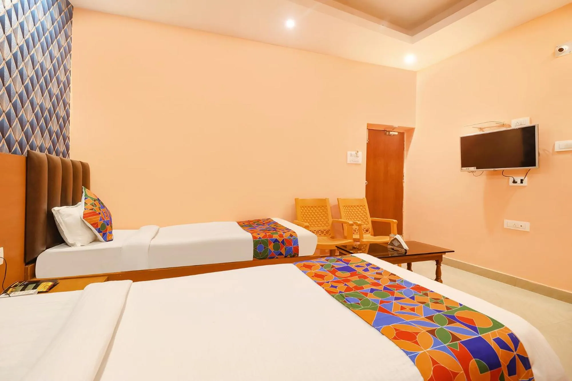 Bed in FabHotel Shanti International