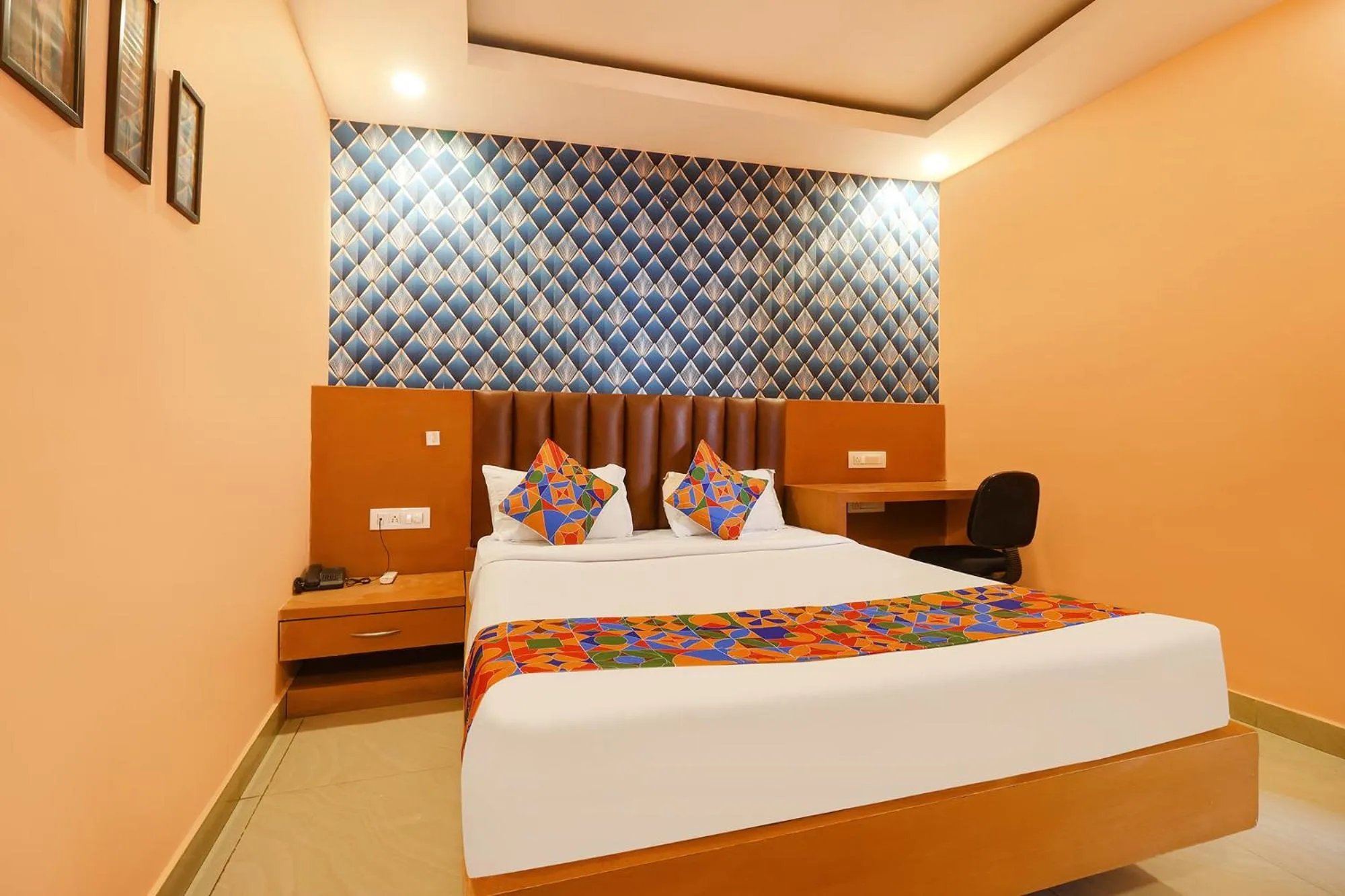 Bed in FabHotel Shanti International