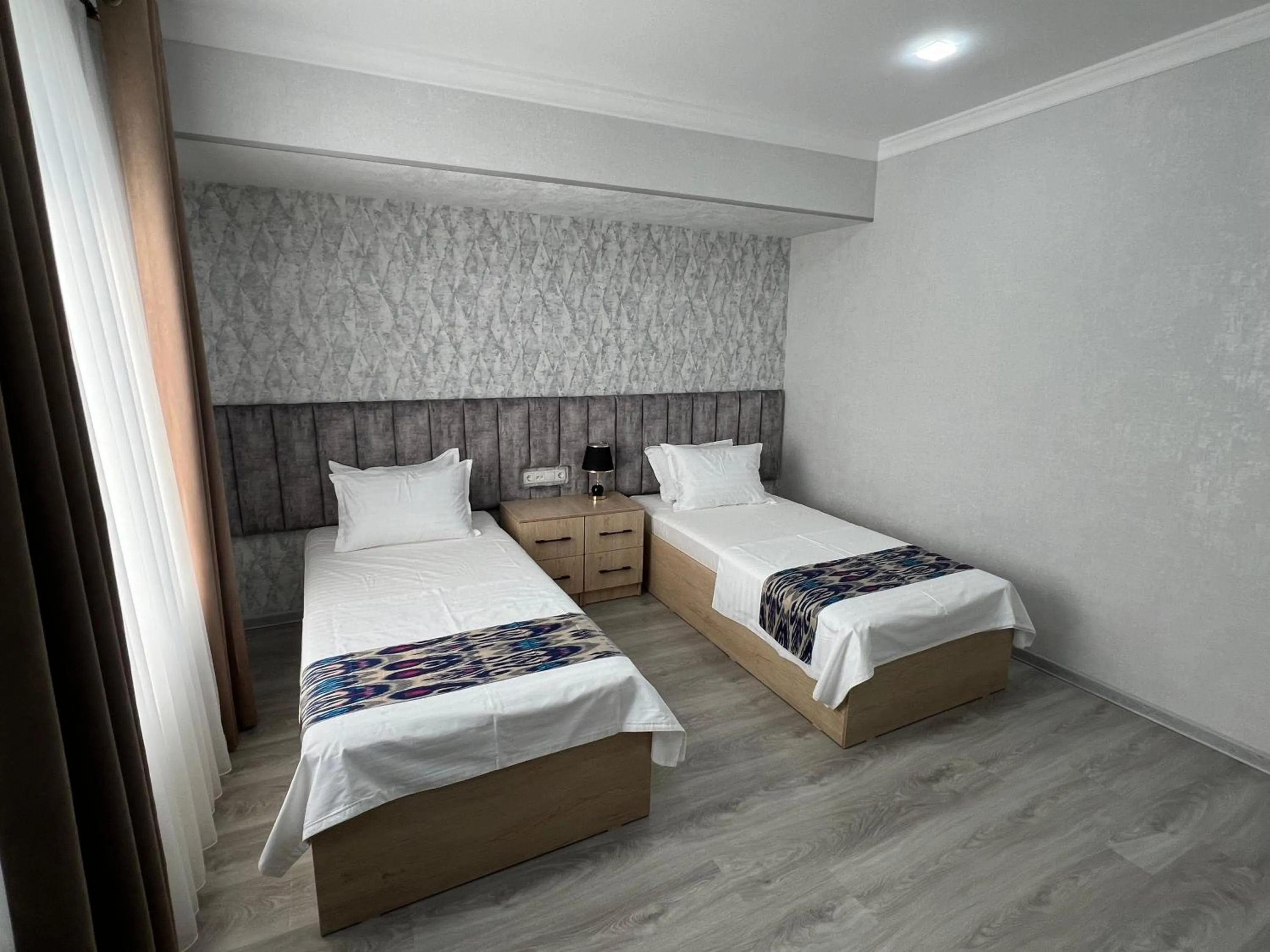 Bed in DSF GARDEN HOTEL