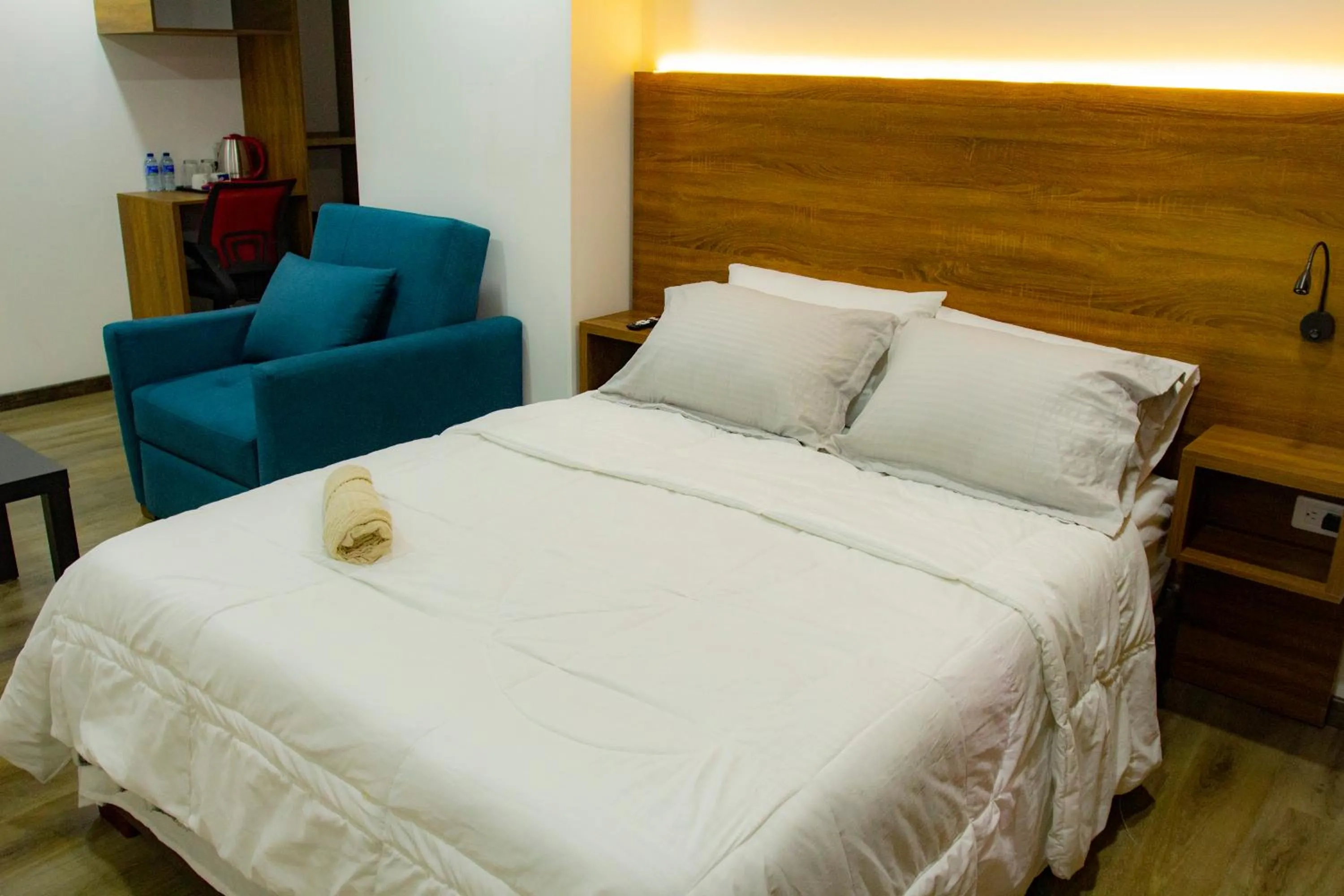 Living room, Bed in BOG Living Suites