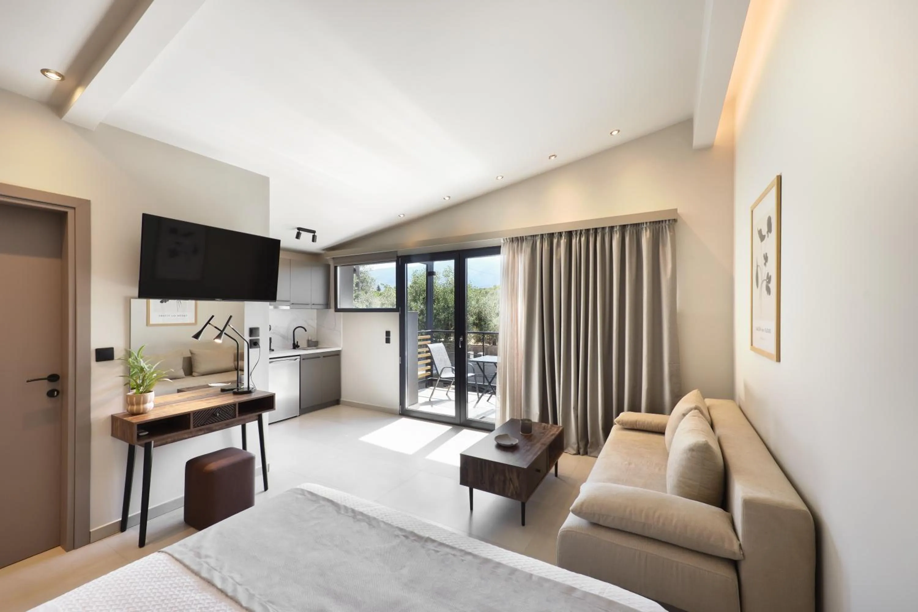 TV and multimedia in Olive All-Seasons Suites, Panel Hospitality Homes & Villas