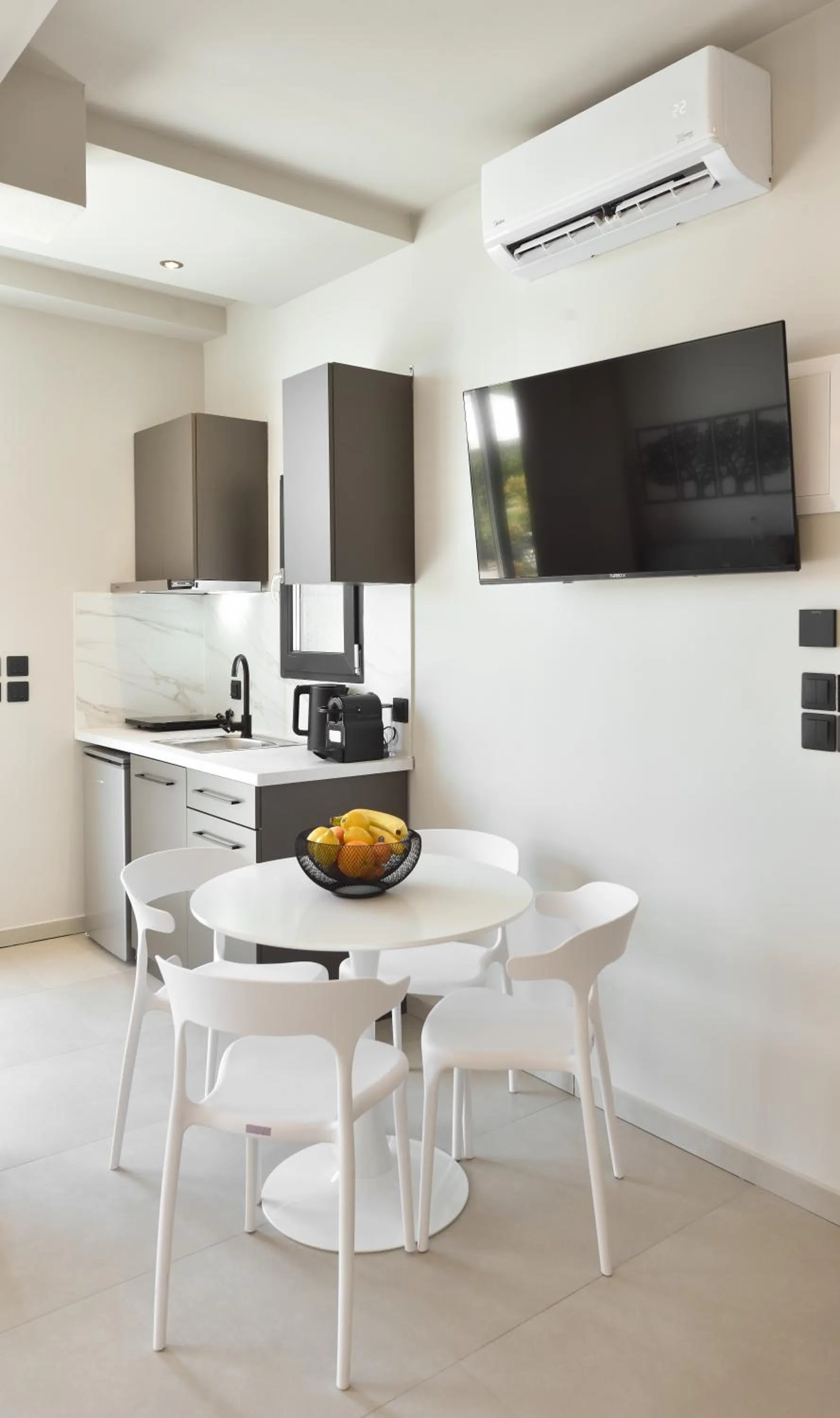 TV and multimedia in Olive All-Seasons Suites, Panel Hospitality Homes & Villas