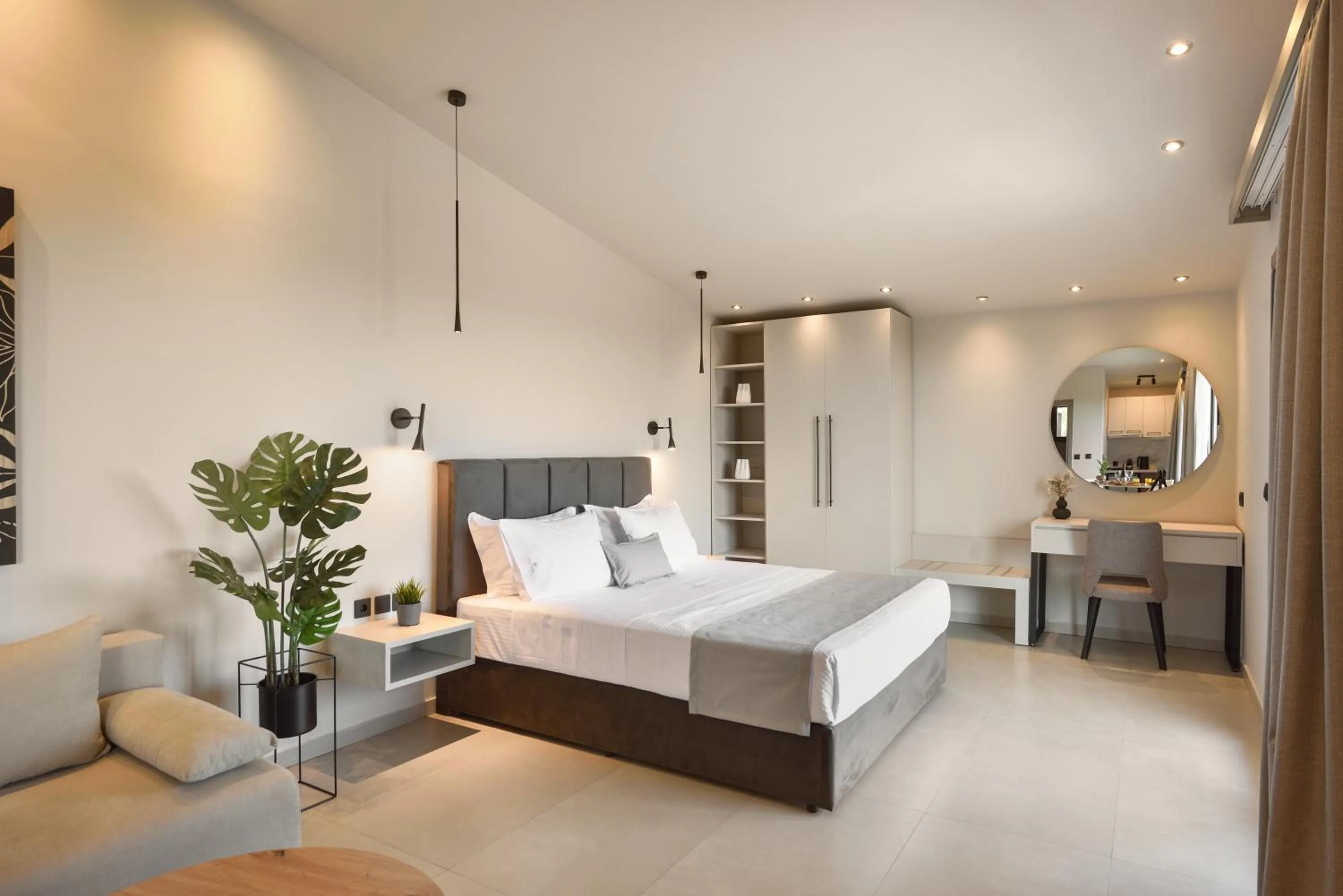 Bed in Olive All-Seasons Suites, Panel Hospitality Homes & Villas