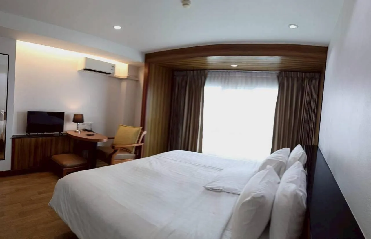 Bed in Cozy Donmueang Hotel
