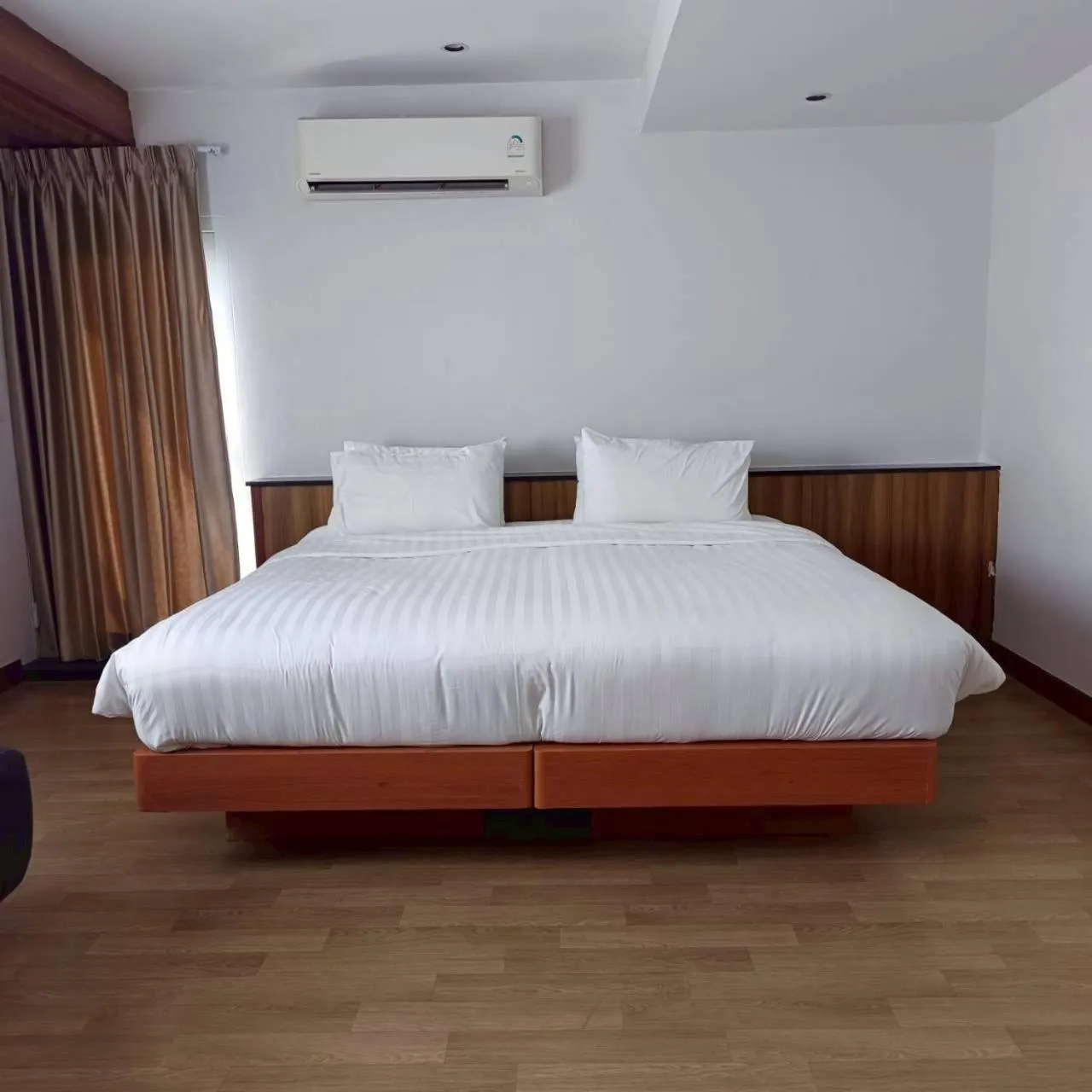 Bed in Cozy Donmueang Hotel