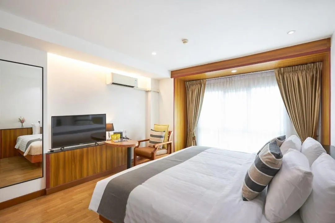 Bed in Cozy Donmueang Hotel