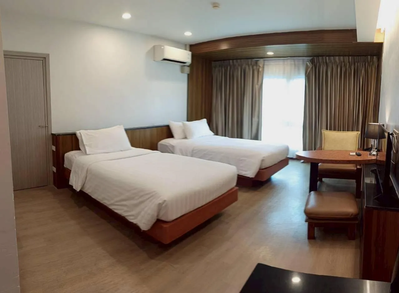 Bed in Cozy Donmueang Hotel