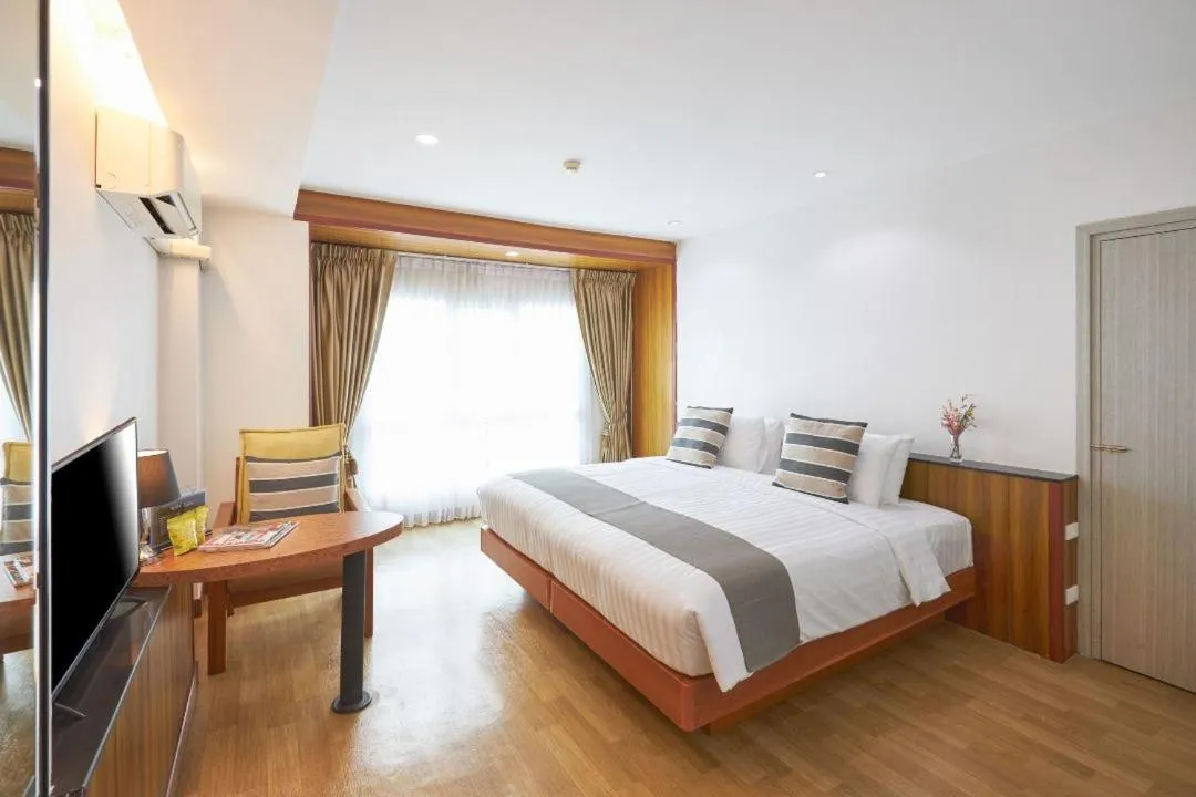 Bed in Cozy Donmueang Hotel