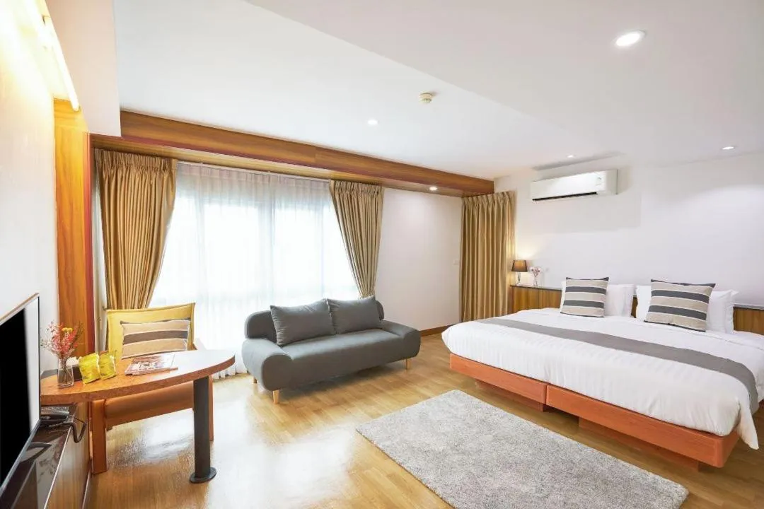 Bed in Cozy Donmueang Hotel