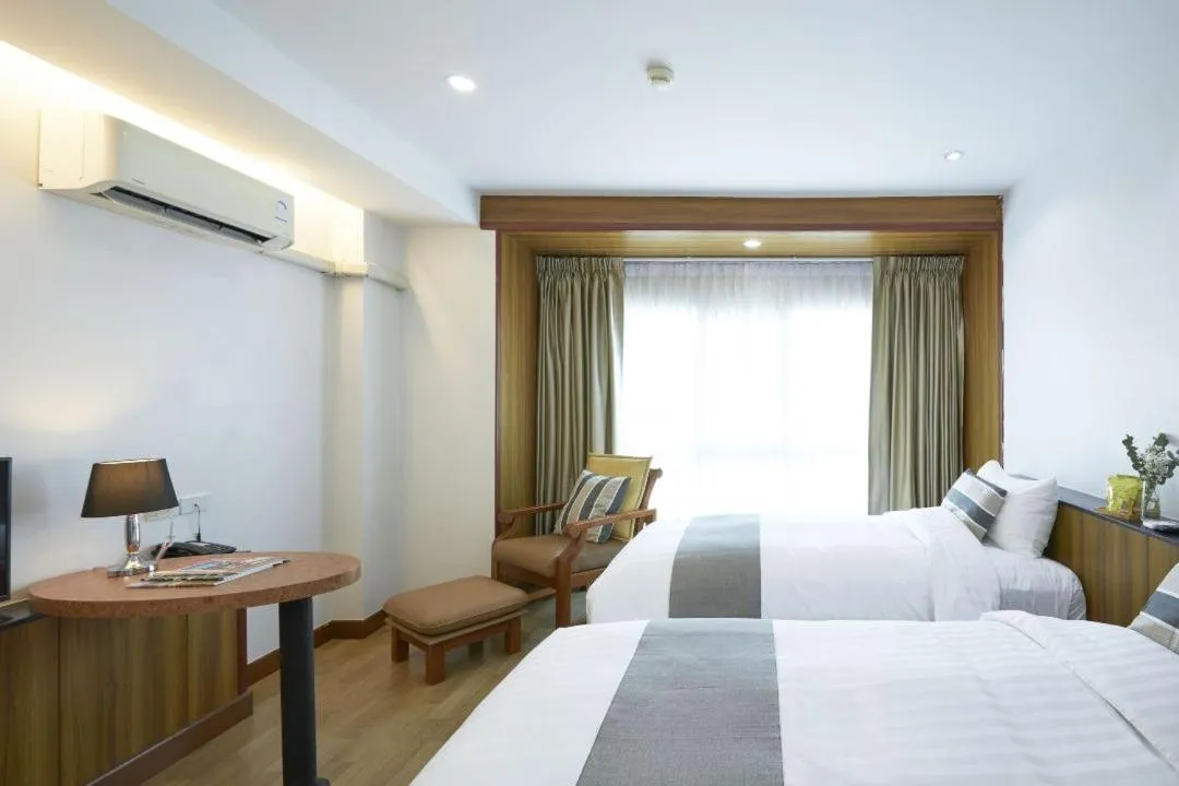 Bed in Cozy Donmueang Hotel