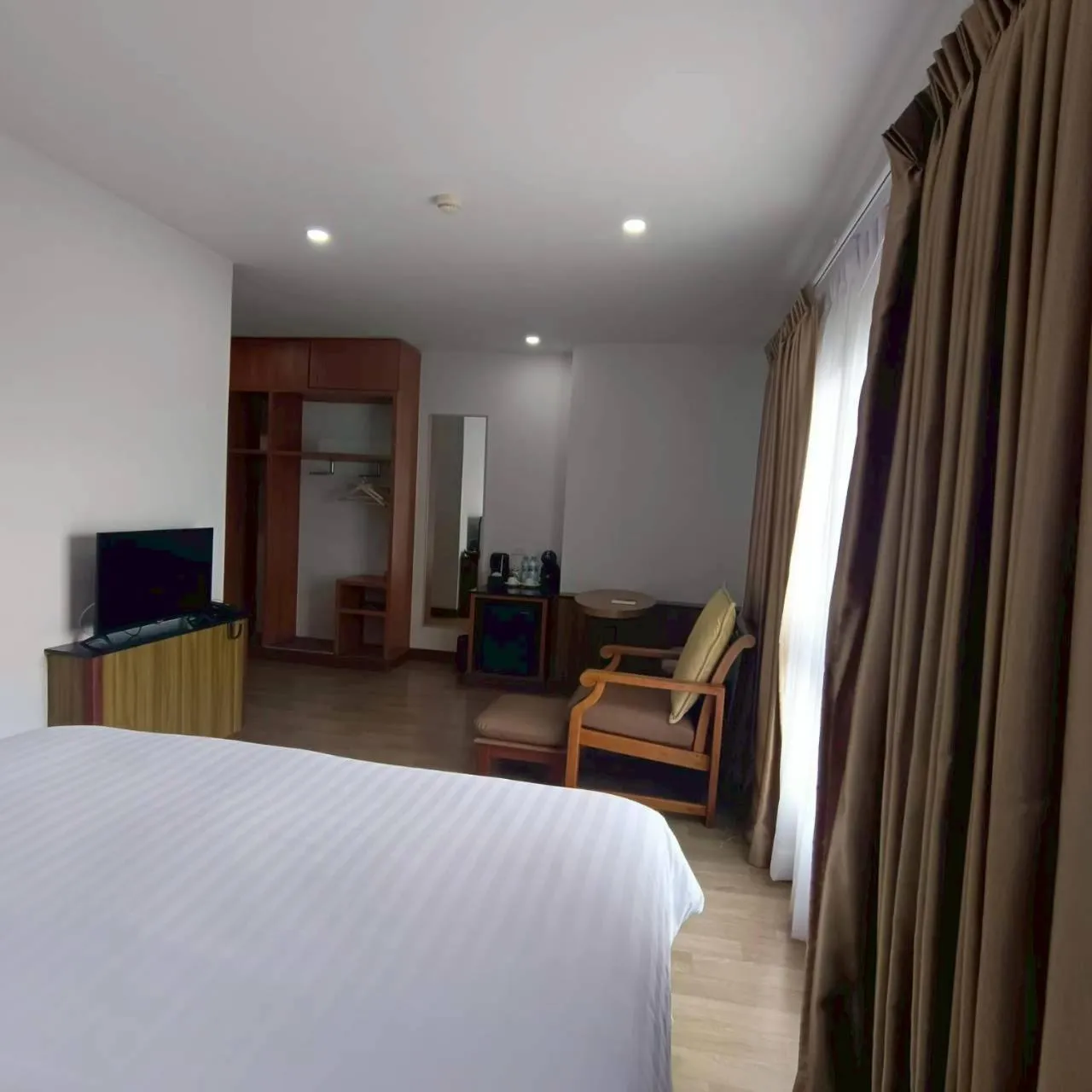 Bed in Cozy Donmueang Hotel