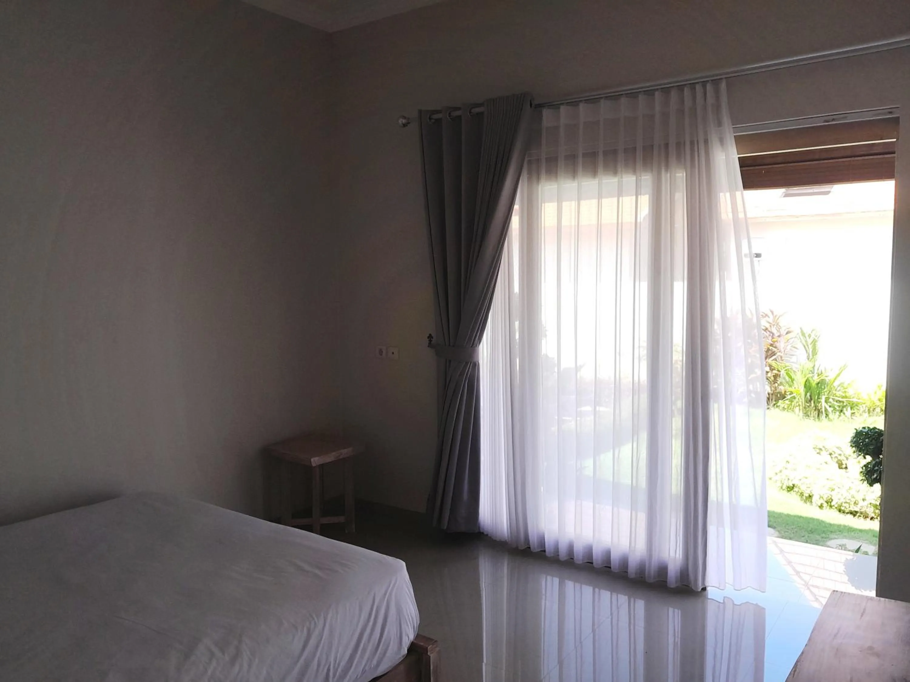 Bed in Maha Rama Villas Amed