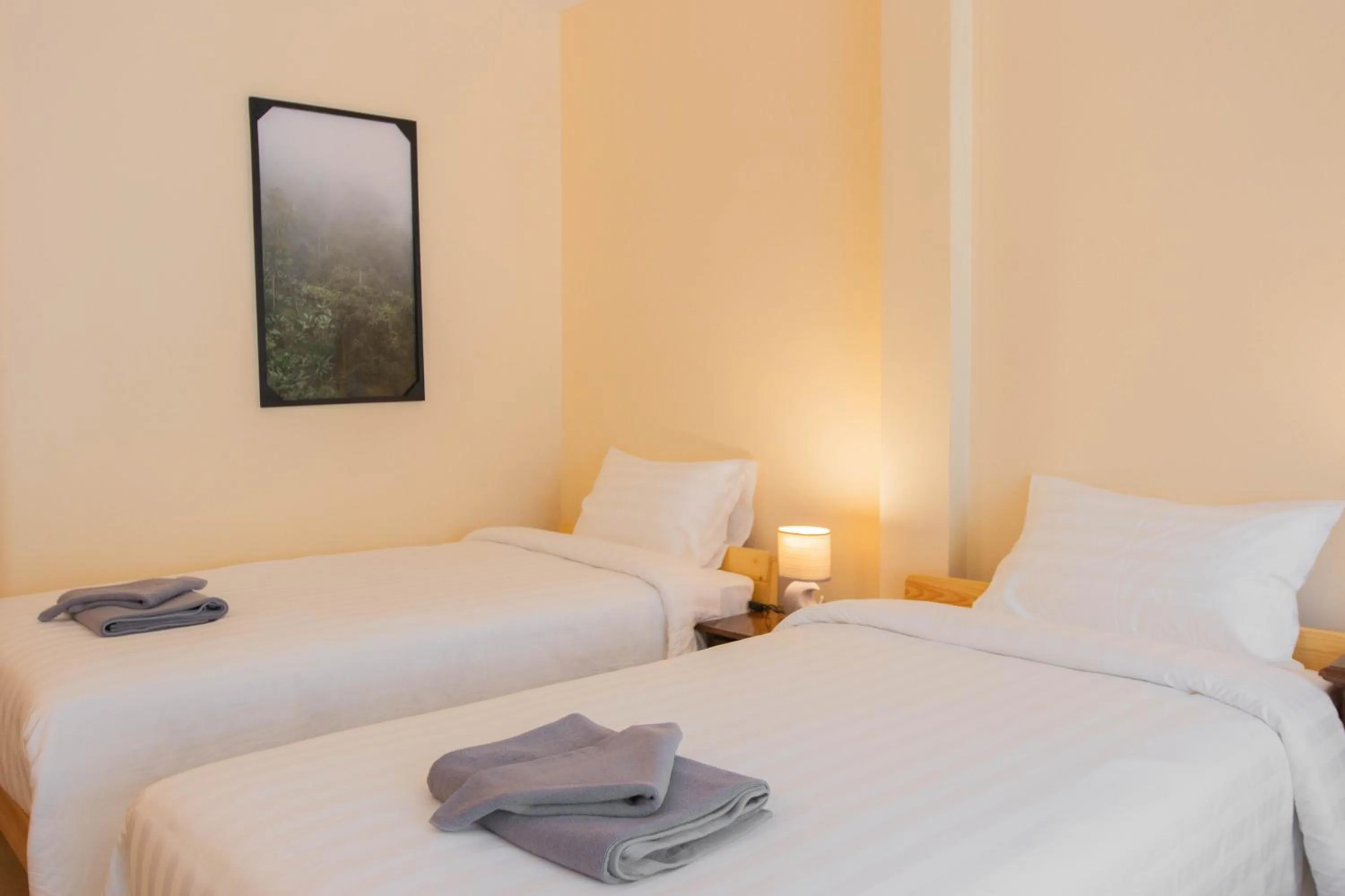 Bed in Maiiam Guesthouse Patong