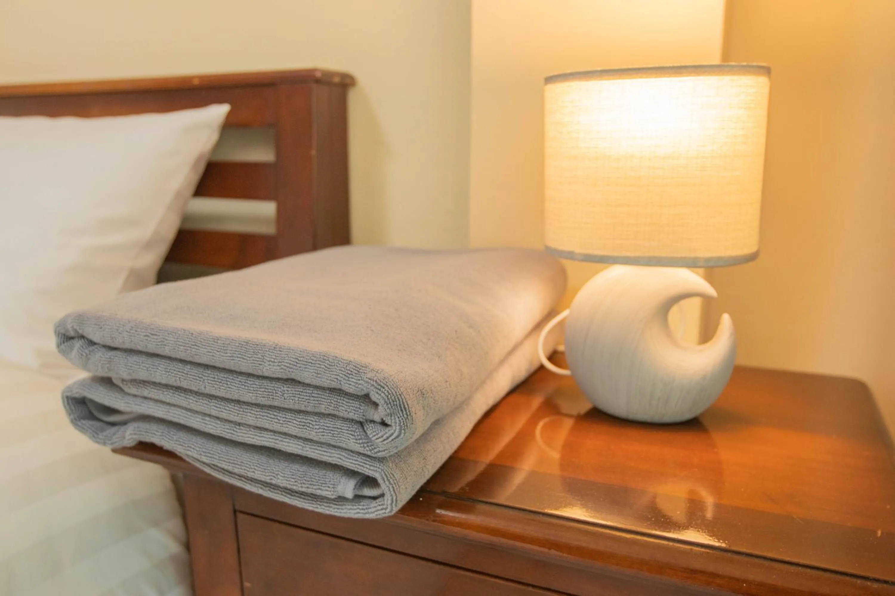 towels, Bed in Maiiam Guesthouse Patong