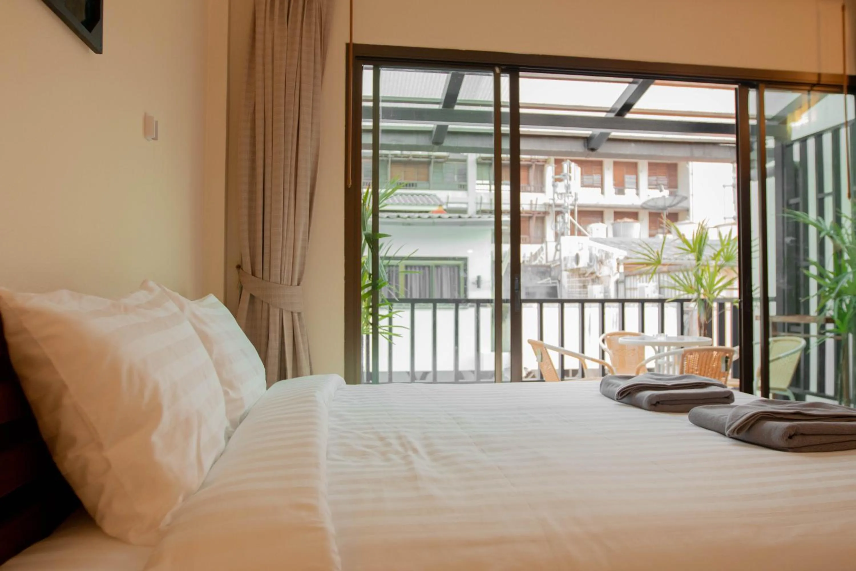 View (from property/room), Bed in Maiiam Guesthouse Patong