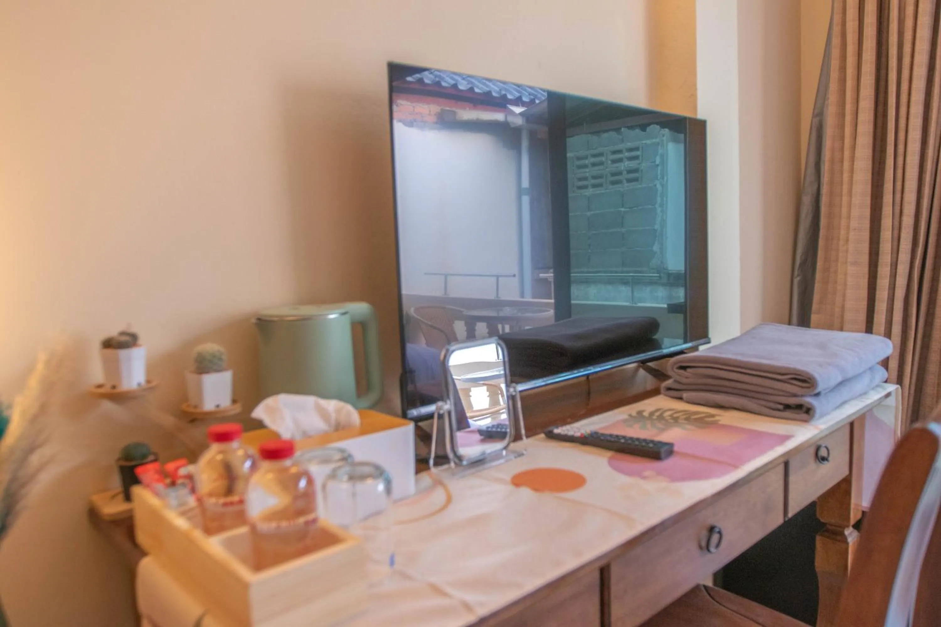 towels, Bed in Maiiam Guesthouse Patong