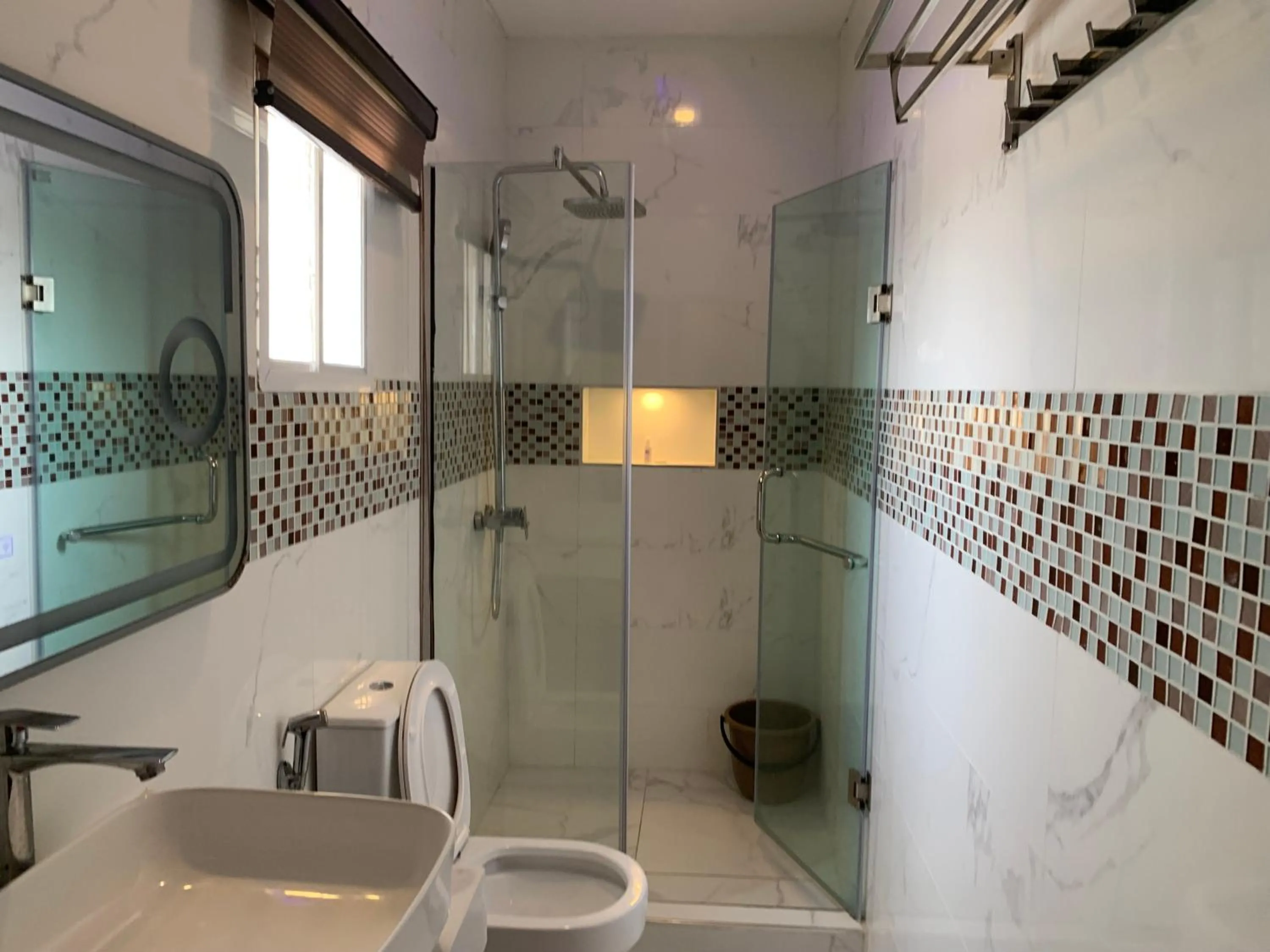 Shower in Presken Kuramo Waters, Victoria Island