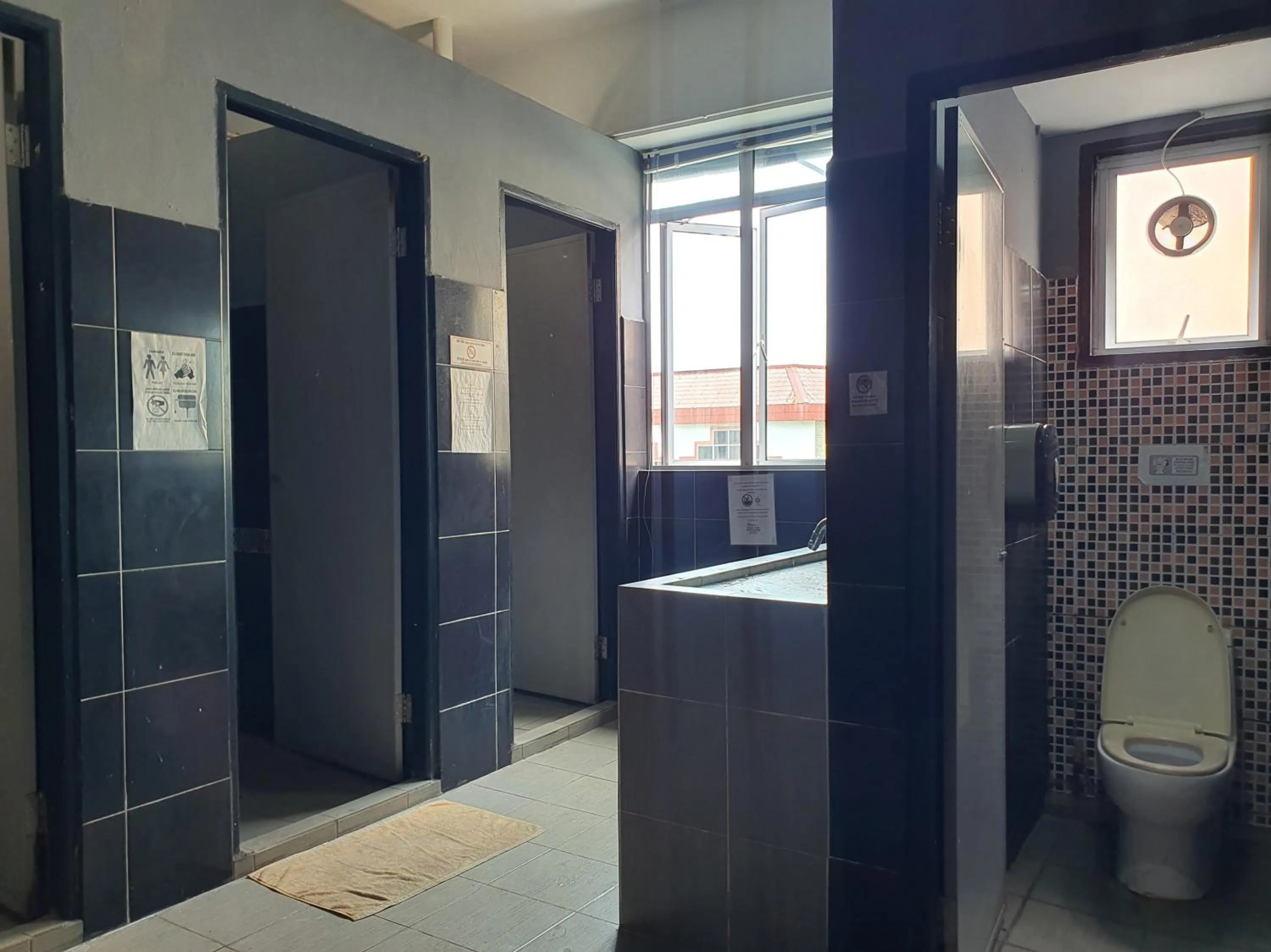 Bathroom in SPOT ON 90984 Gn Homestay