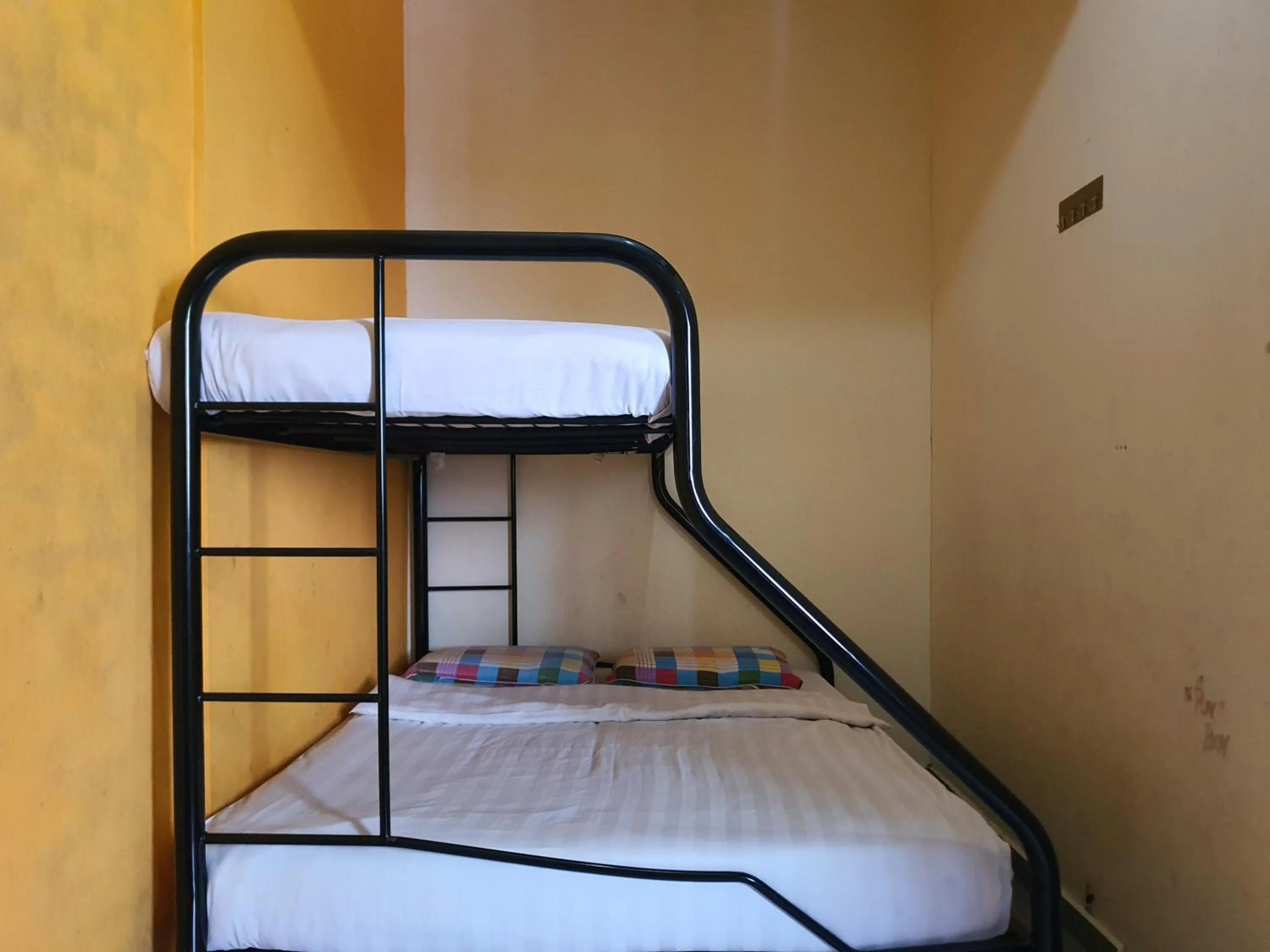 Bedroom in SPOT ON 90984 Gn Homestay