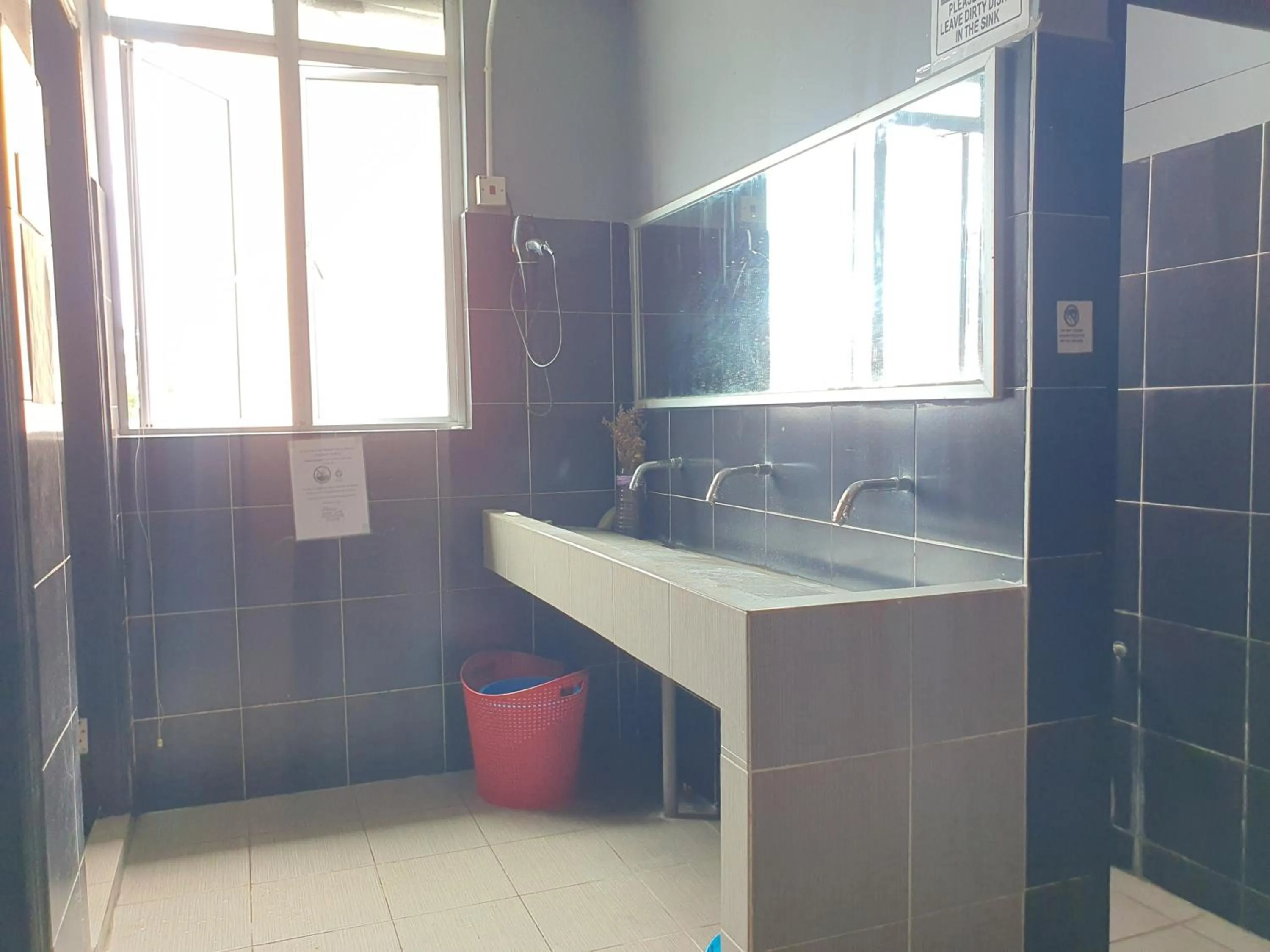 Bathroom in SPOT ON 90984 Gn Homestay