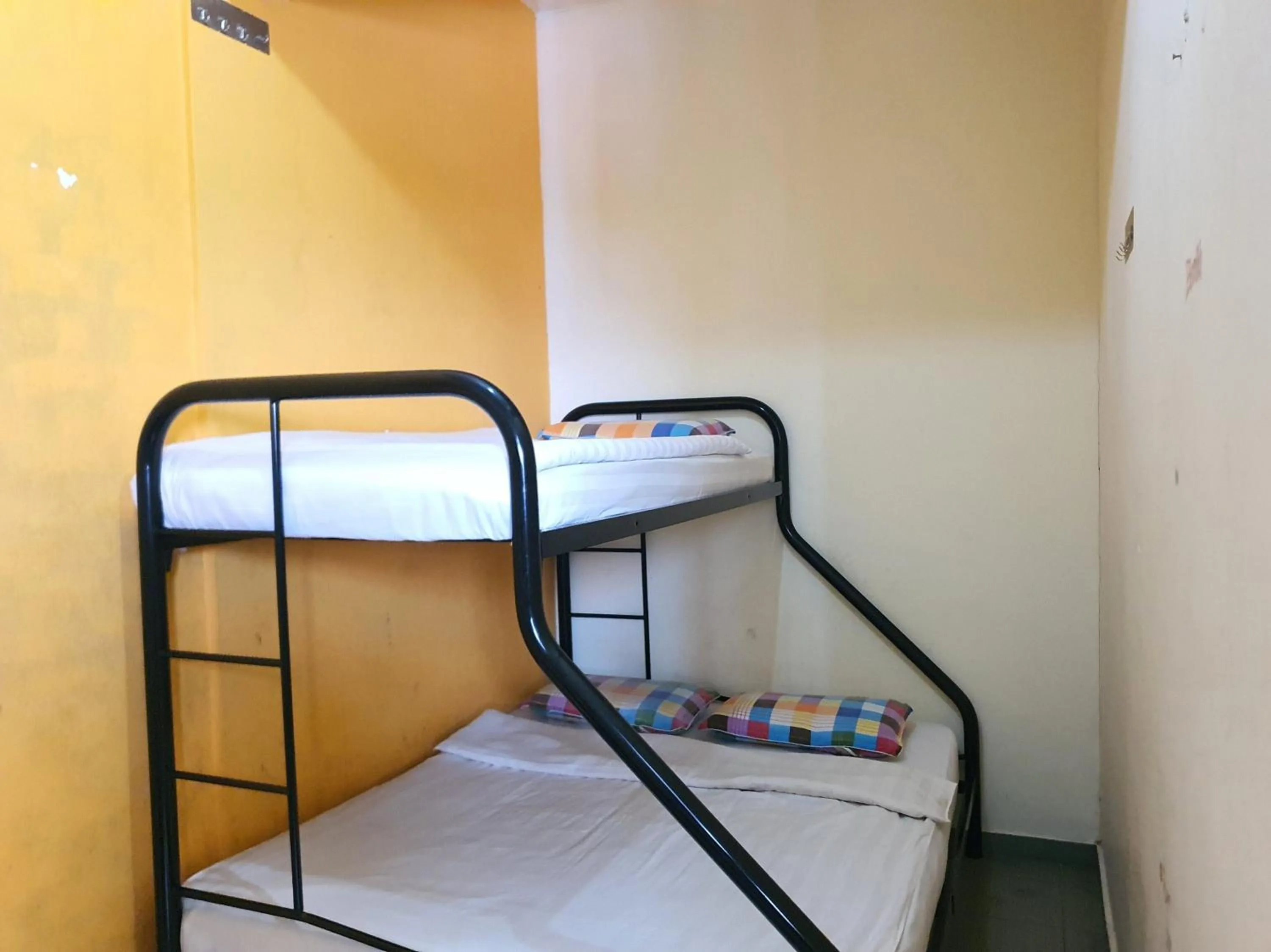 Bedroom in SPOT ON 90984 Gn Homestay