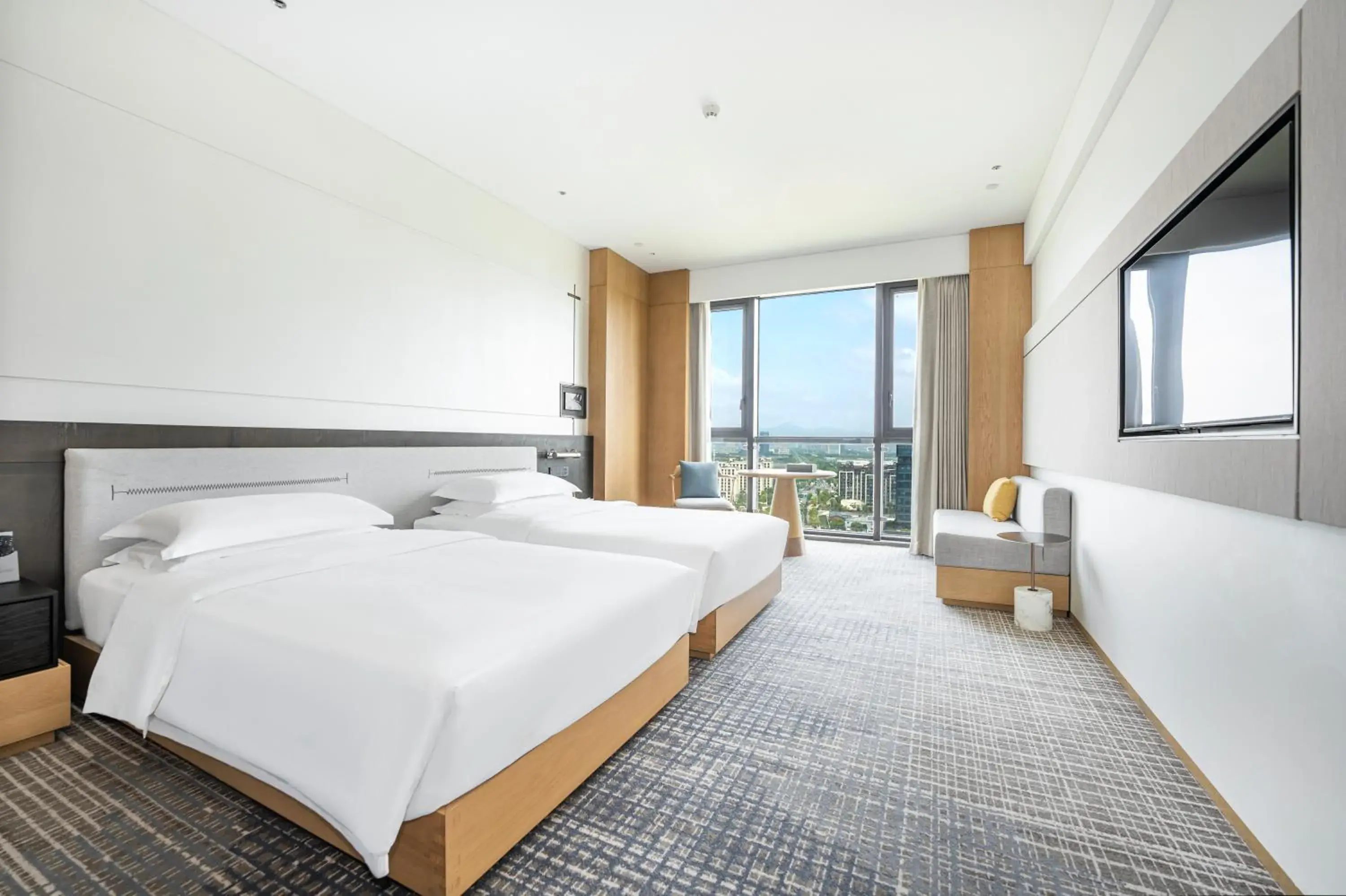 Bed in Holiday Inn Ningbo Xiangshan Damu Bay by IHG Bed in Holiday Inn Ningbo Xiangshan Damu Bay by IHG