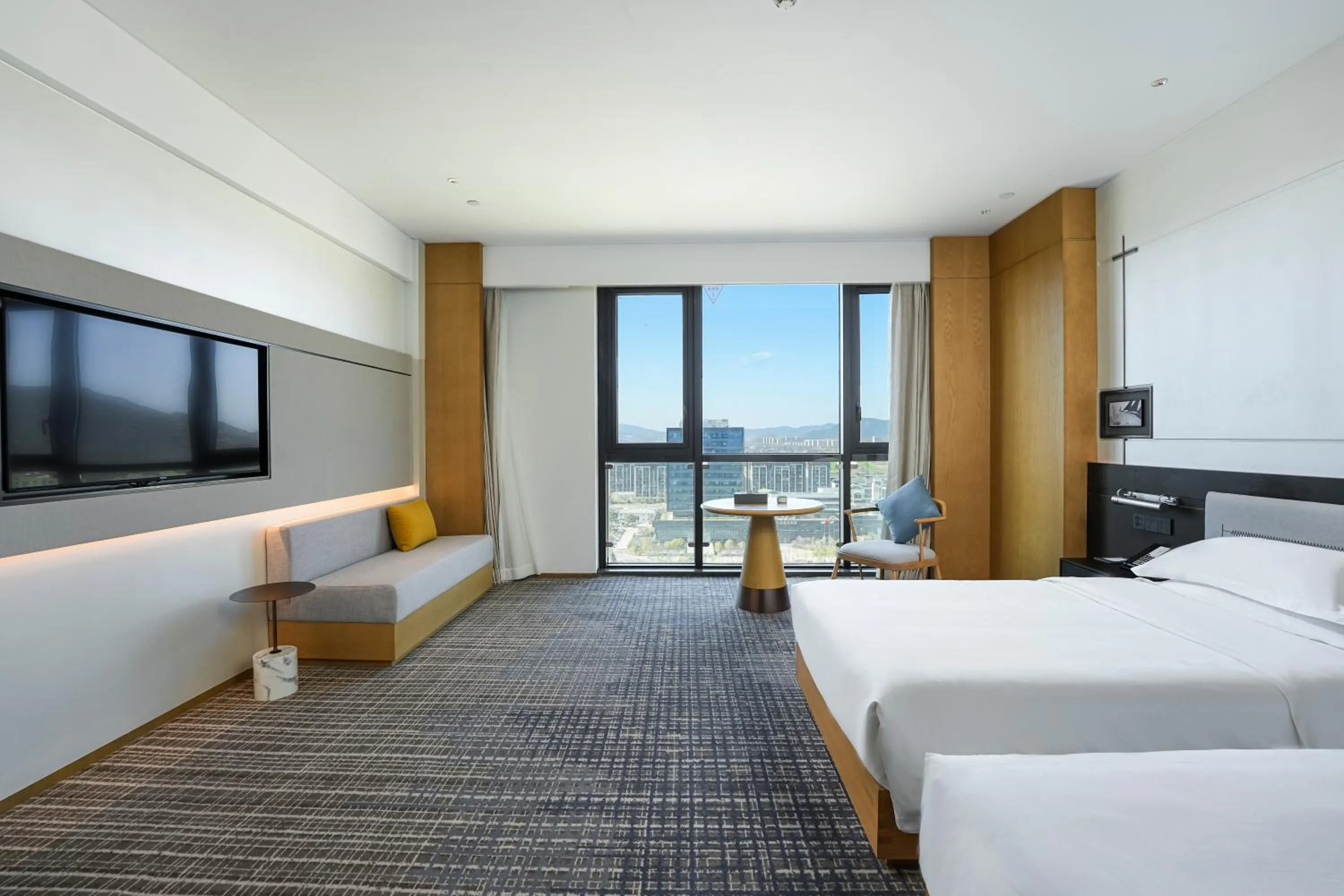 Bed in Holiday Inn Ningbo Xiangshan Damu Bay by IHG