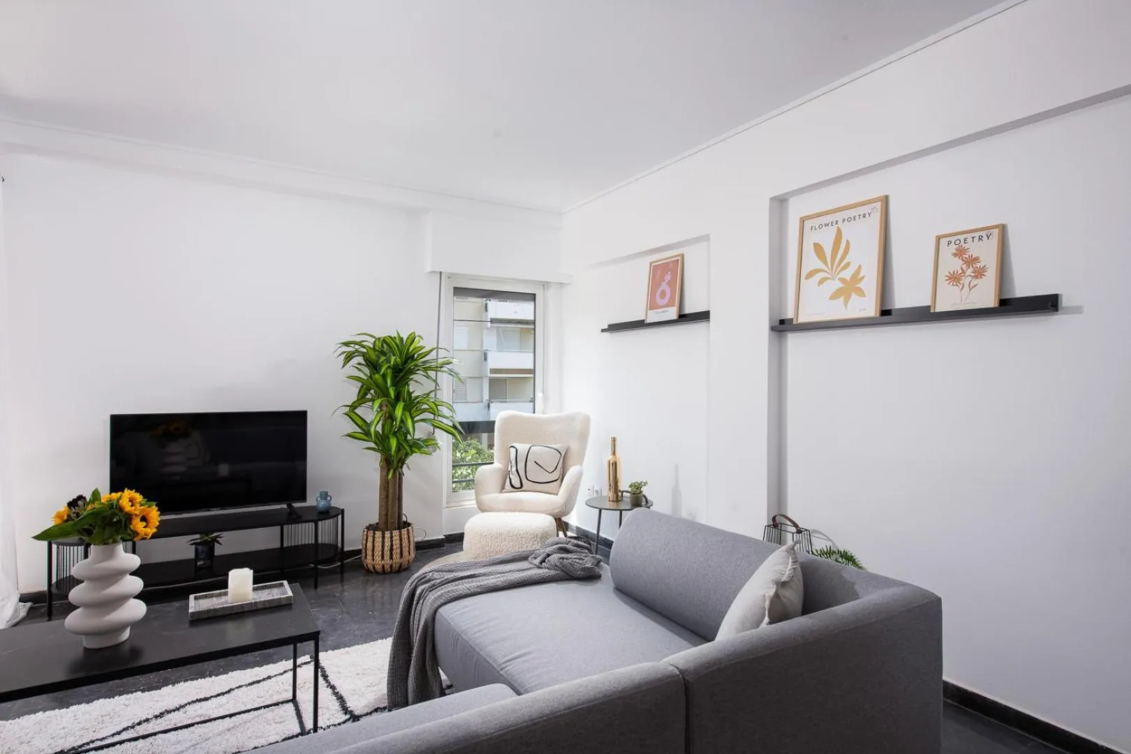 Communal lounge/ TV room in Glyfada First Class Suite by First Class Properties