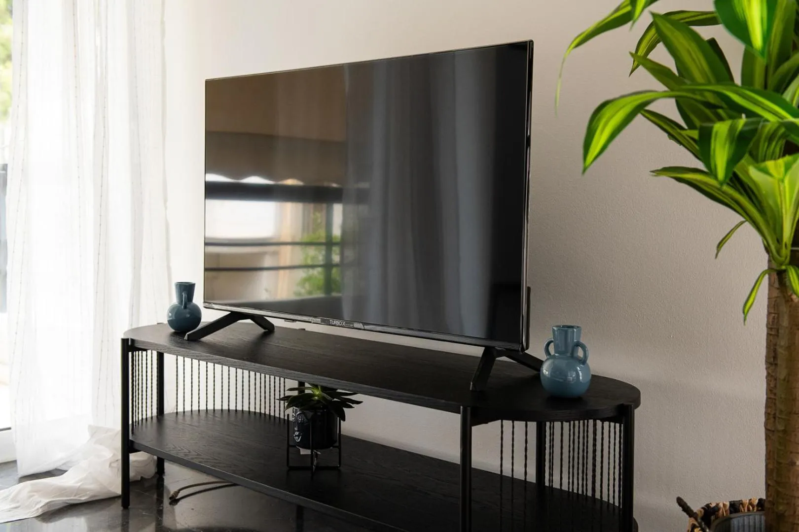 Communal lounge/ TV room in Glyfada First Class Suite by First Class Properties