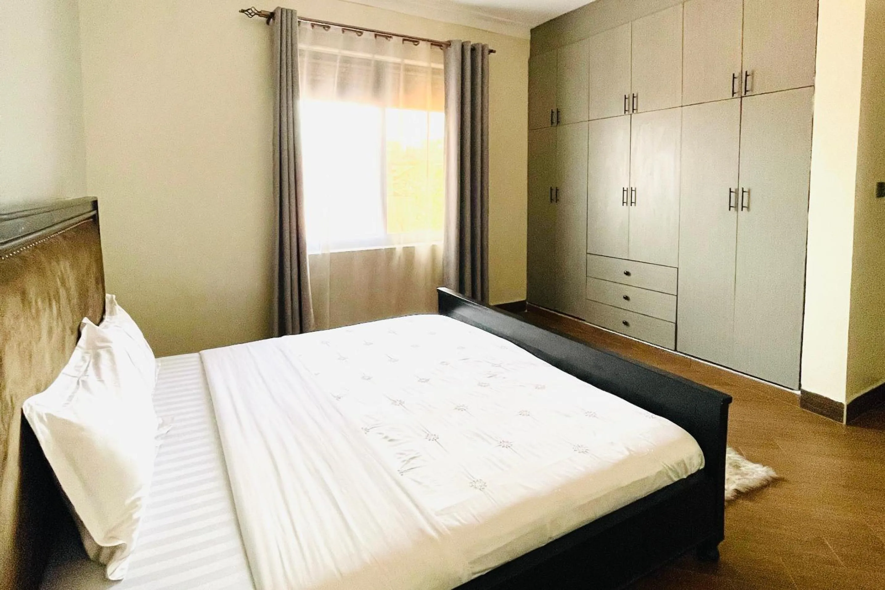 Bed in Cozy Kampala Apartment with Great Views