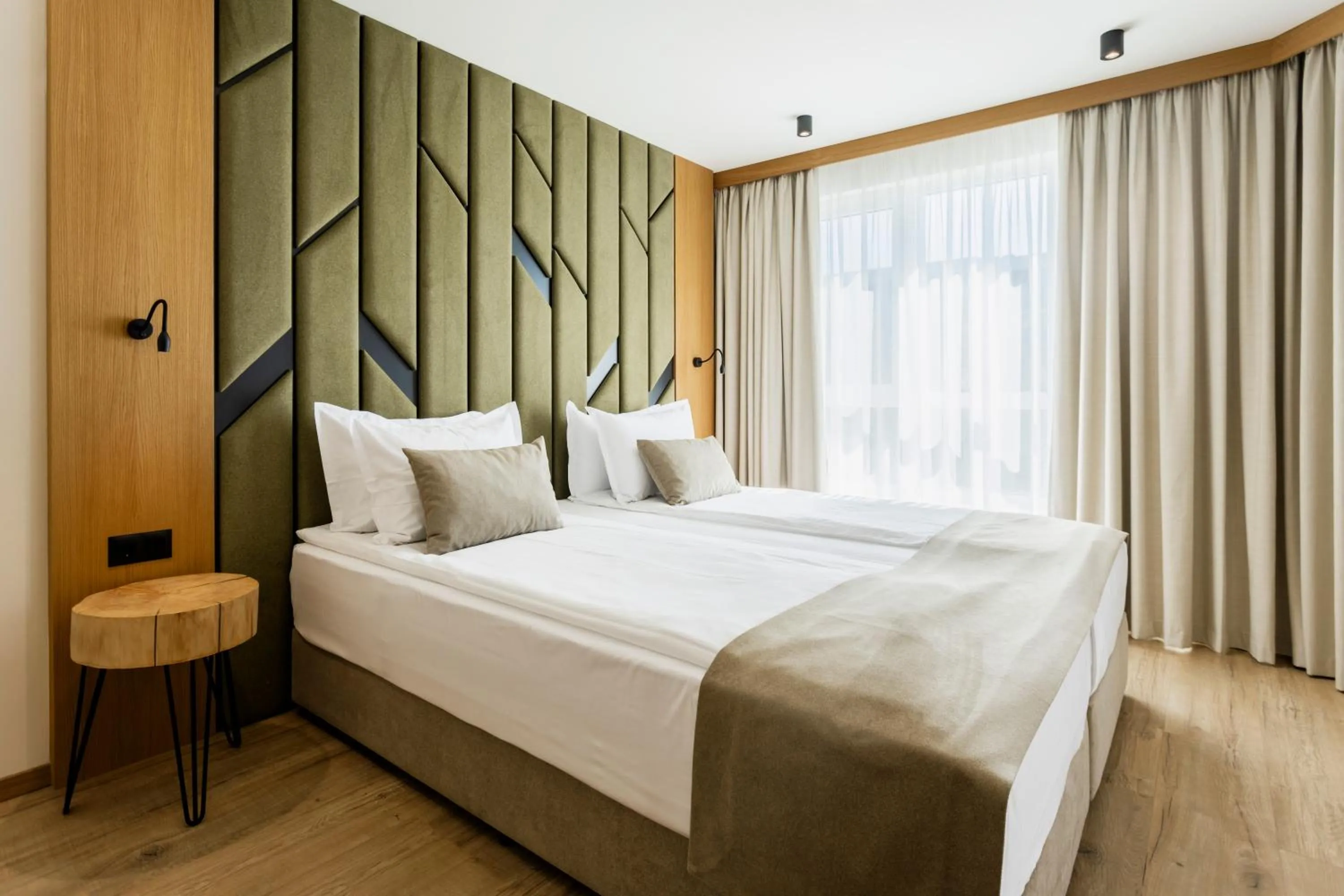 Bed in Natura All Seasons Boutique Hotel