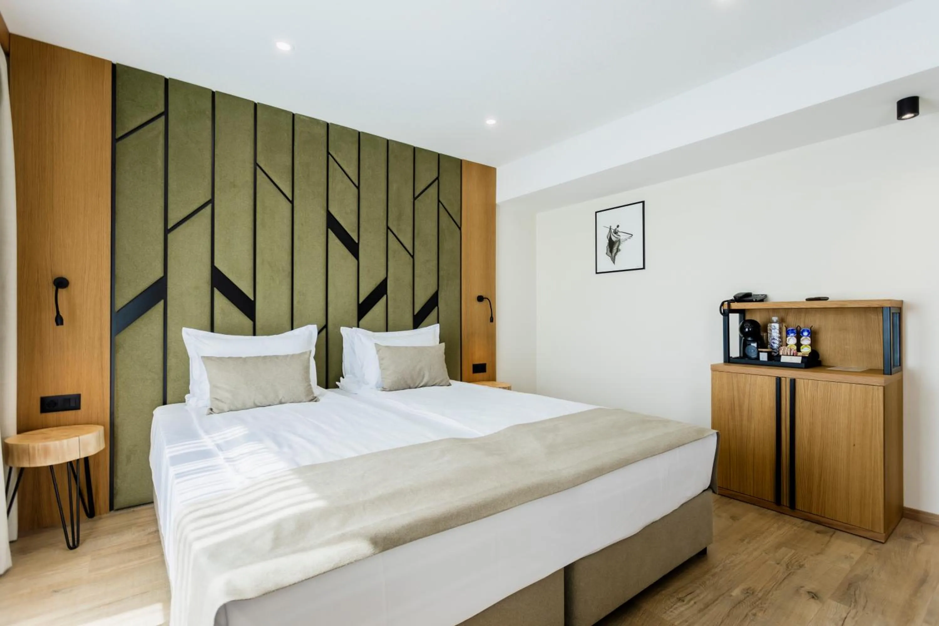 Bed in Natura All Seasons Boutique Hotel
