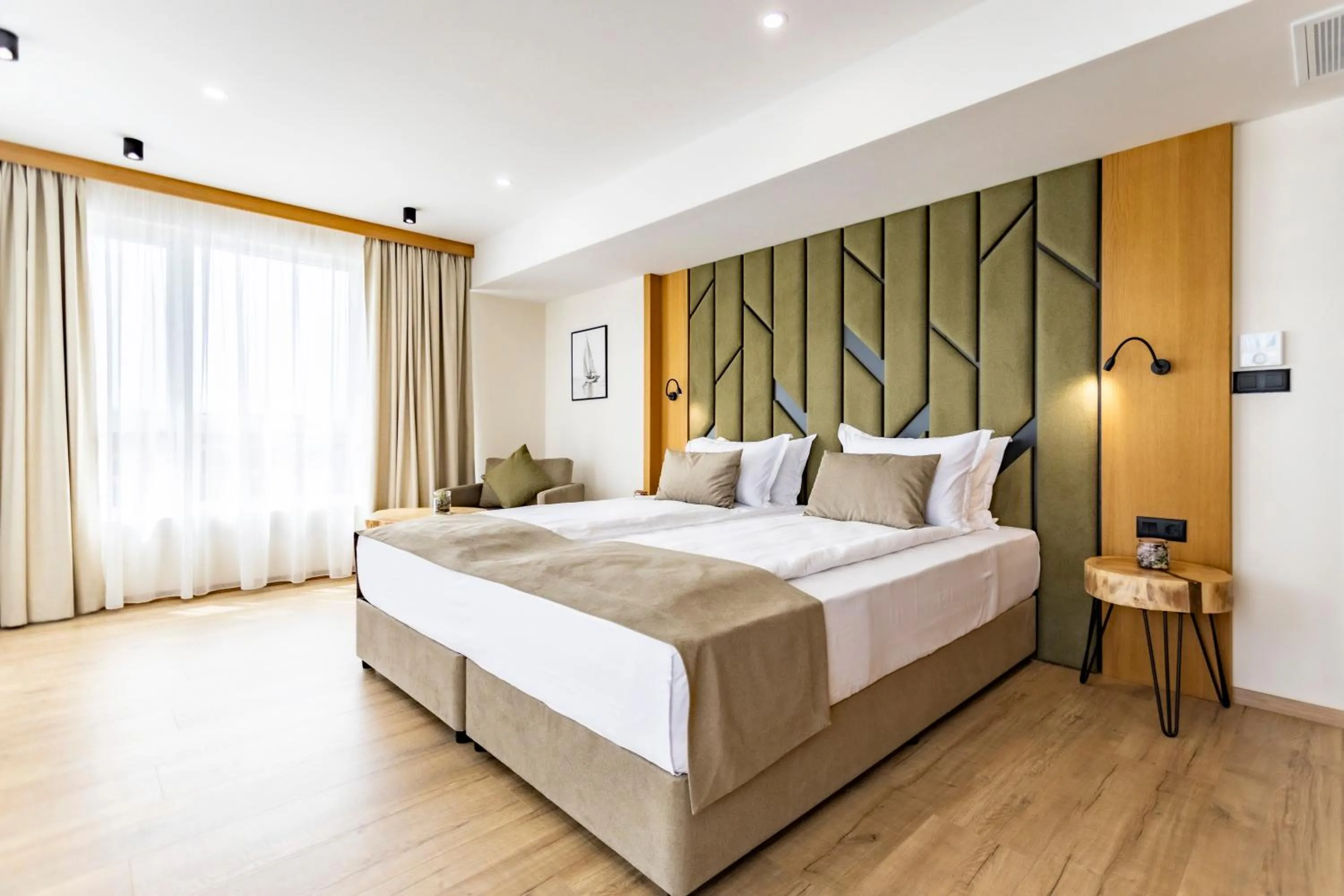 Bed in Natura All Seasons Boutique Hotel