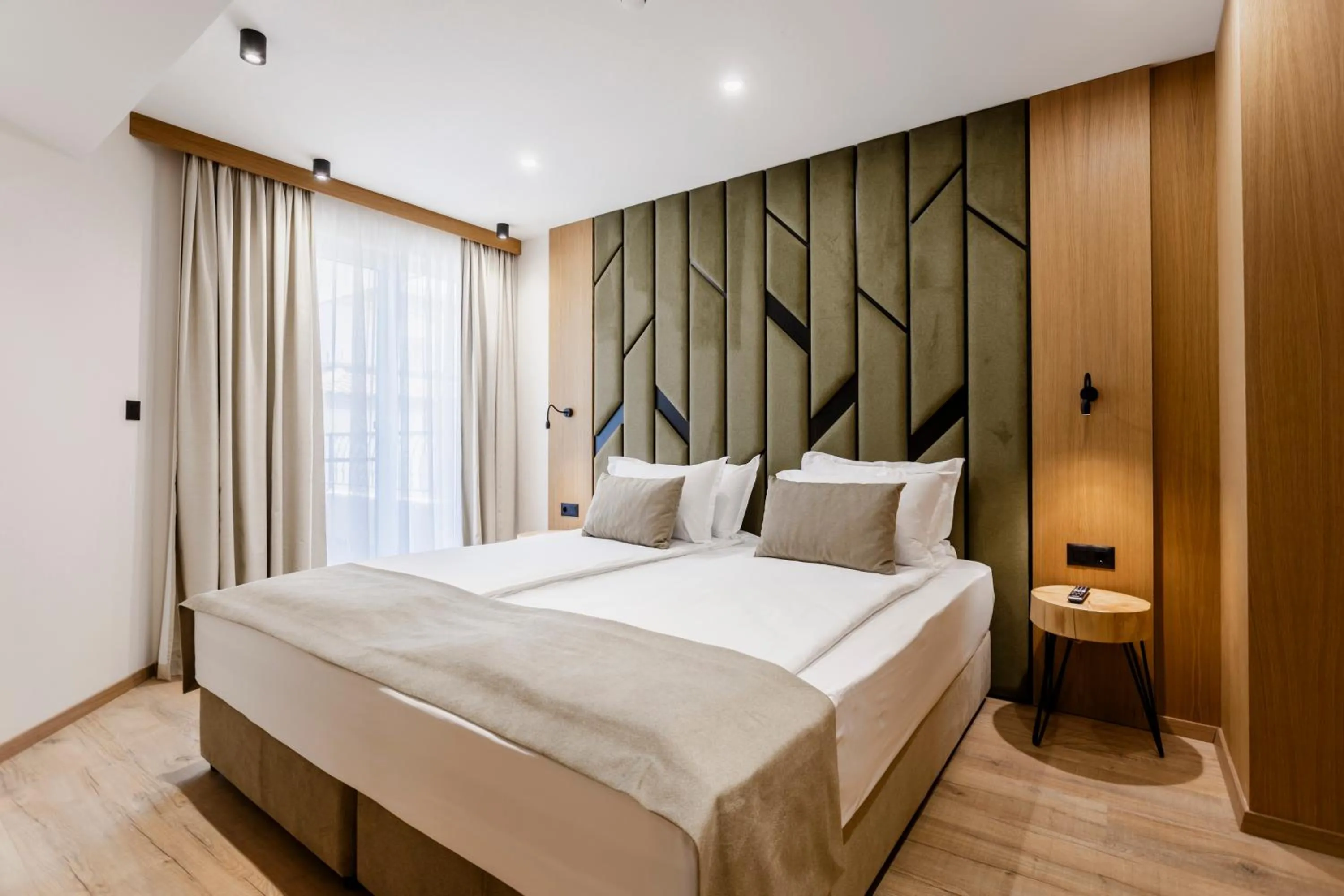 Bed in Natura All Seasons Boutique Hotel