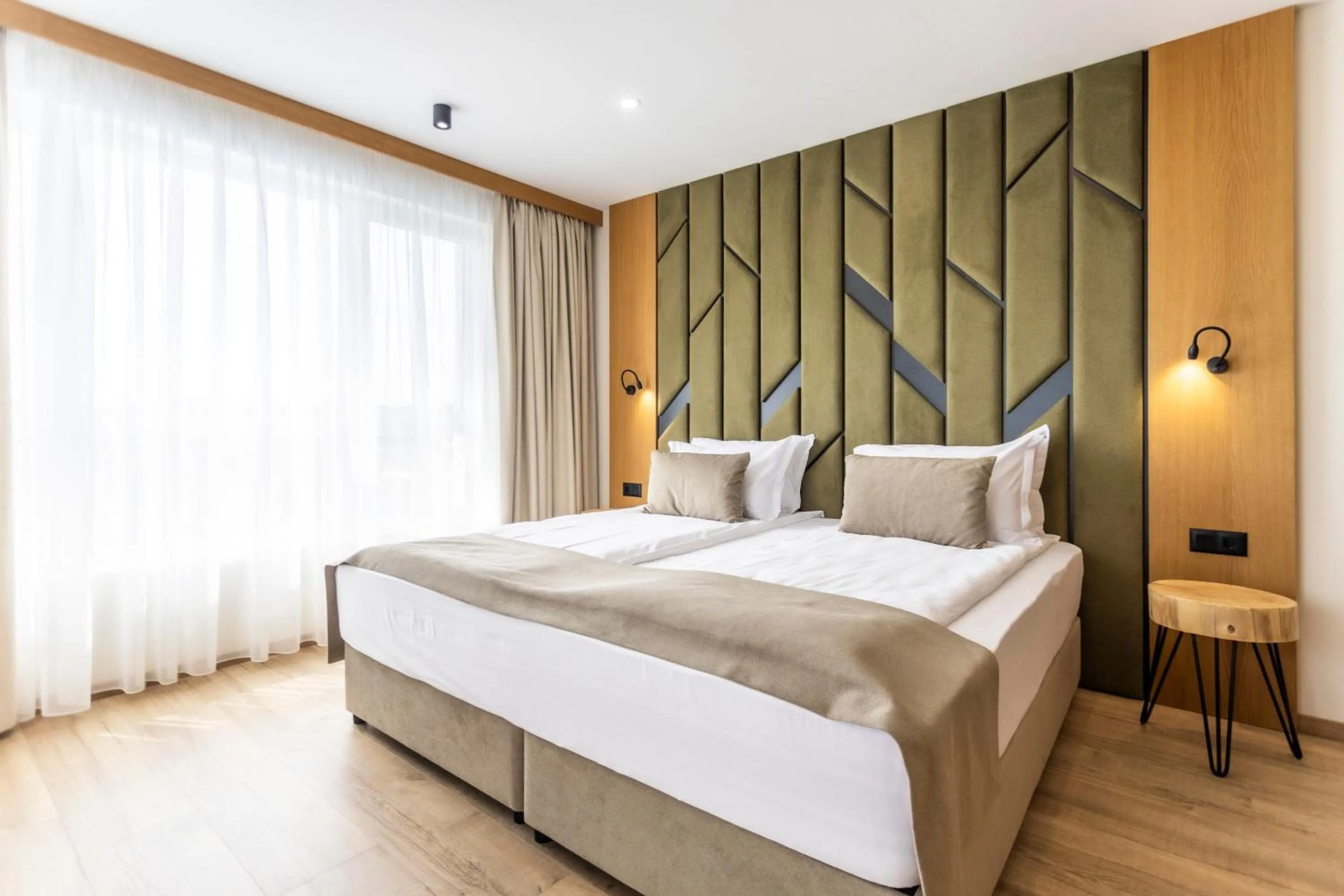 Bed in Natura All Seasons Boutique Hotel
