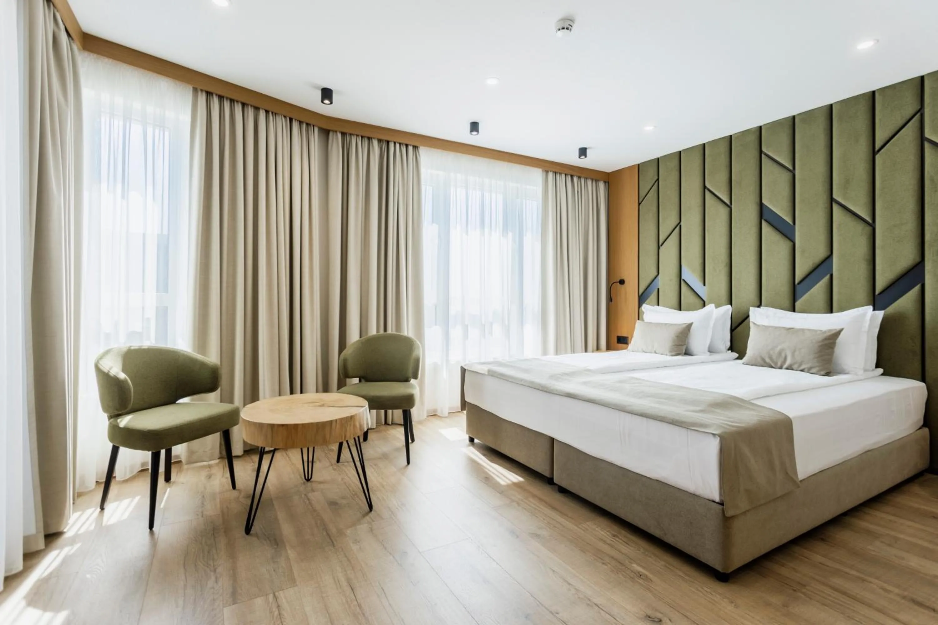 Bed in Natura All Seasons Boutique Hotel