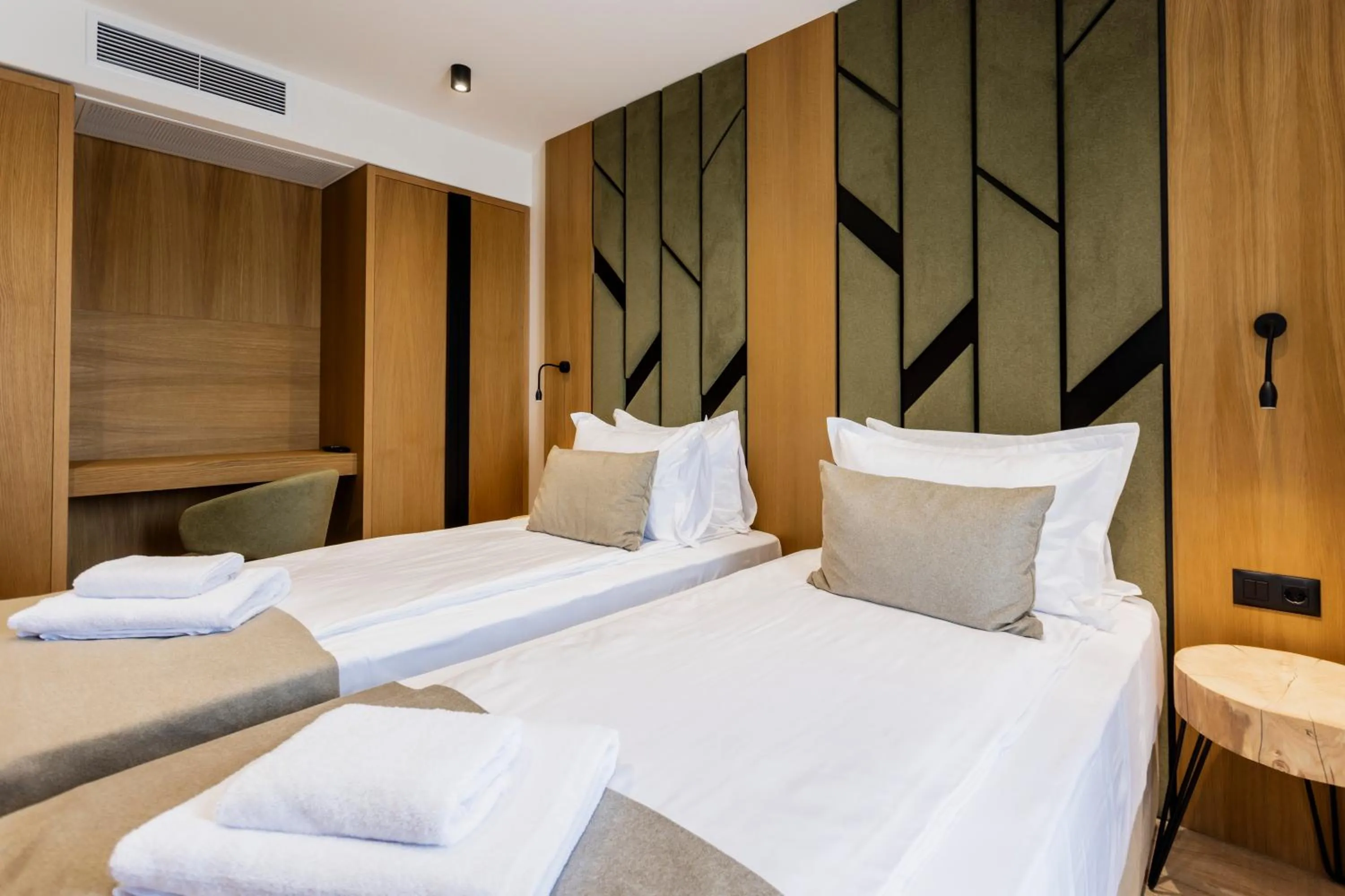 Bed in Natura All Seasons Boutique Hotel