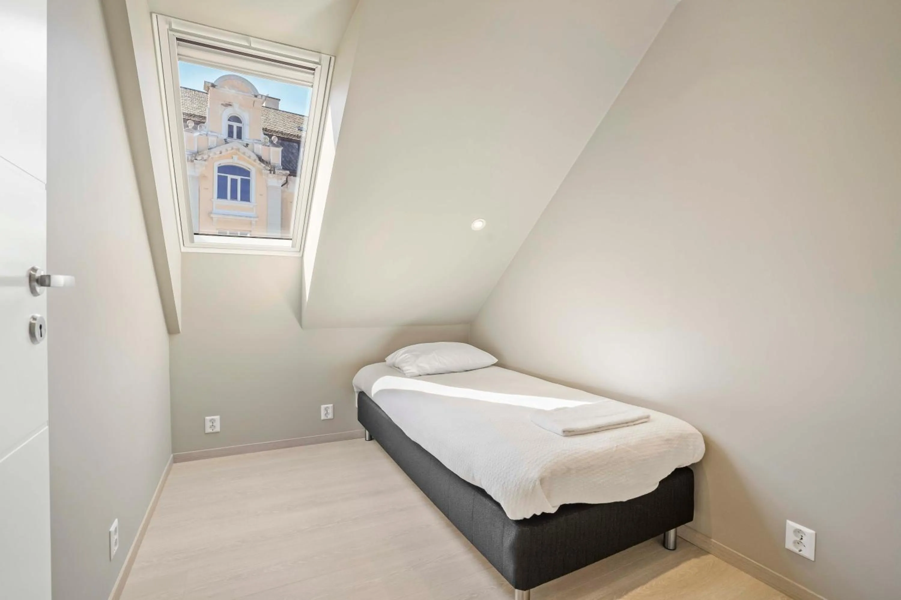 Bed in Florø Apartments Hotell