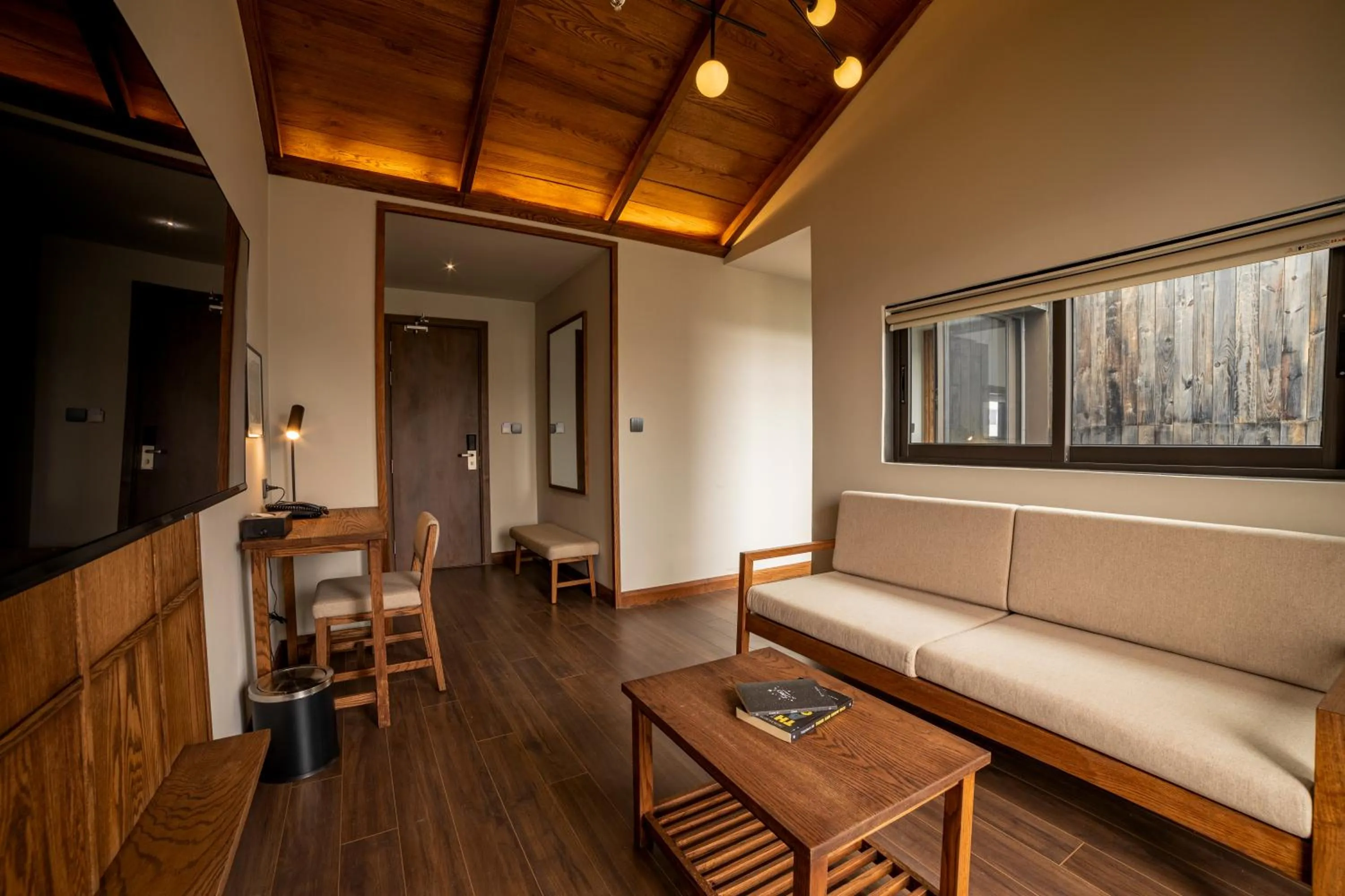 Communal lounge/ TV room in HLS Dalat Lodge