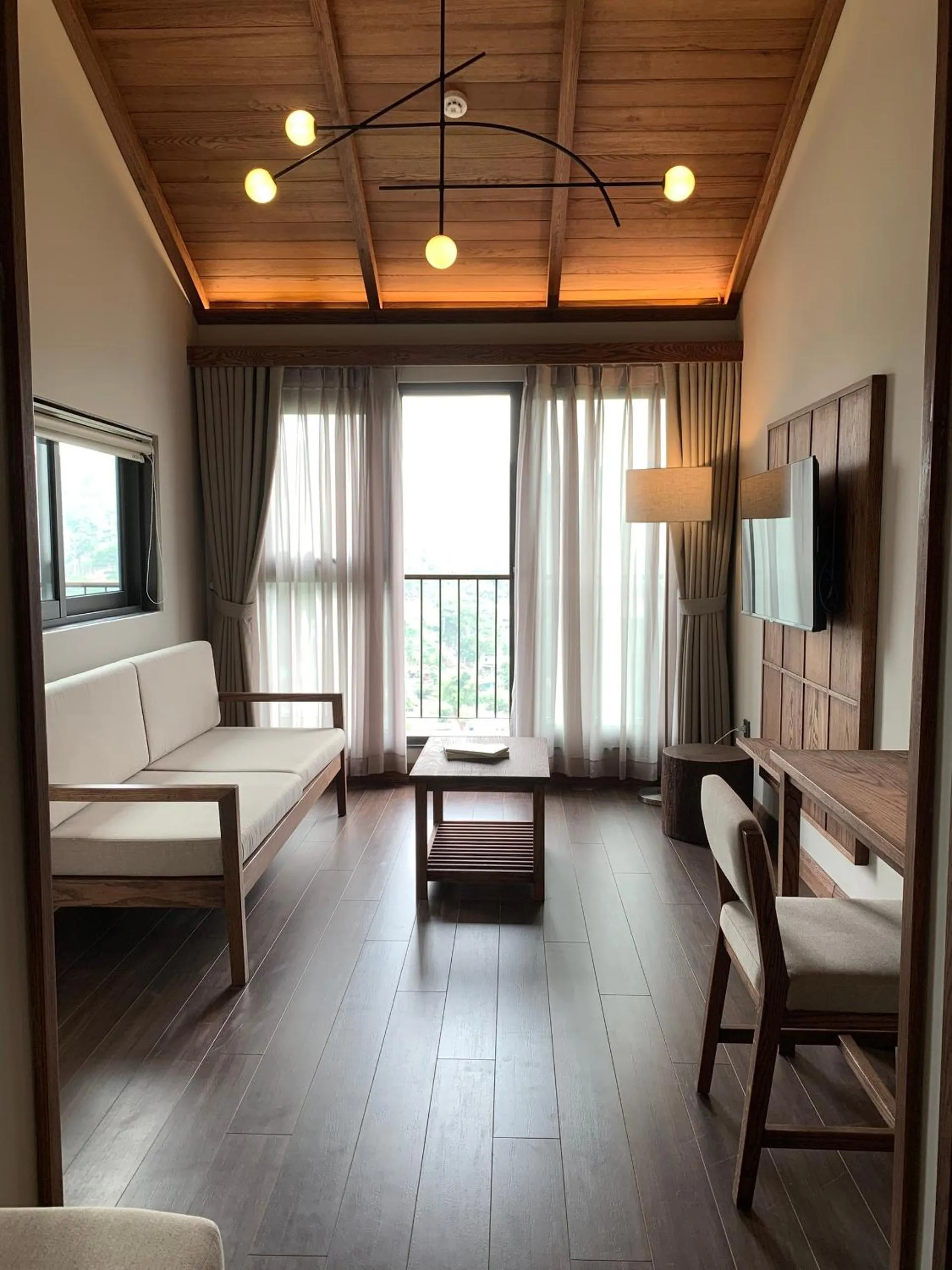 Communal lounge/ TV room, Bed in HLS Dalat Lodge