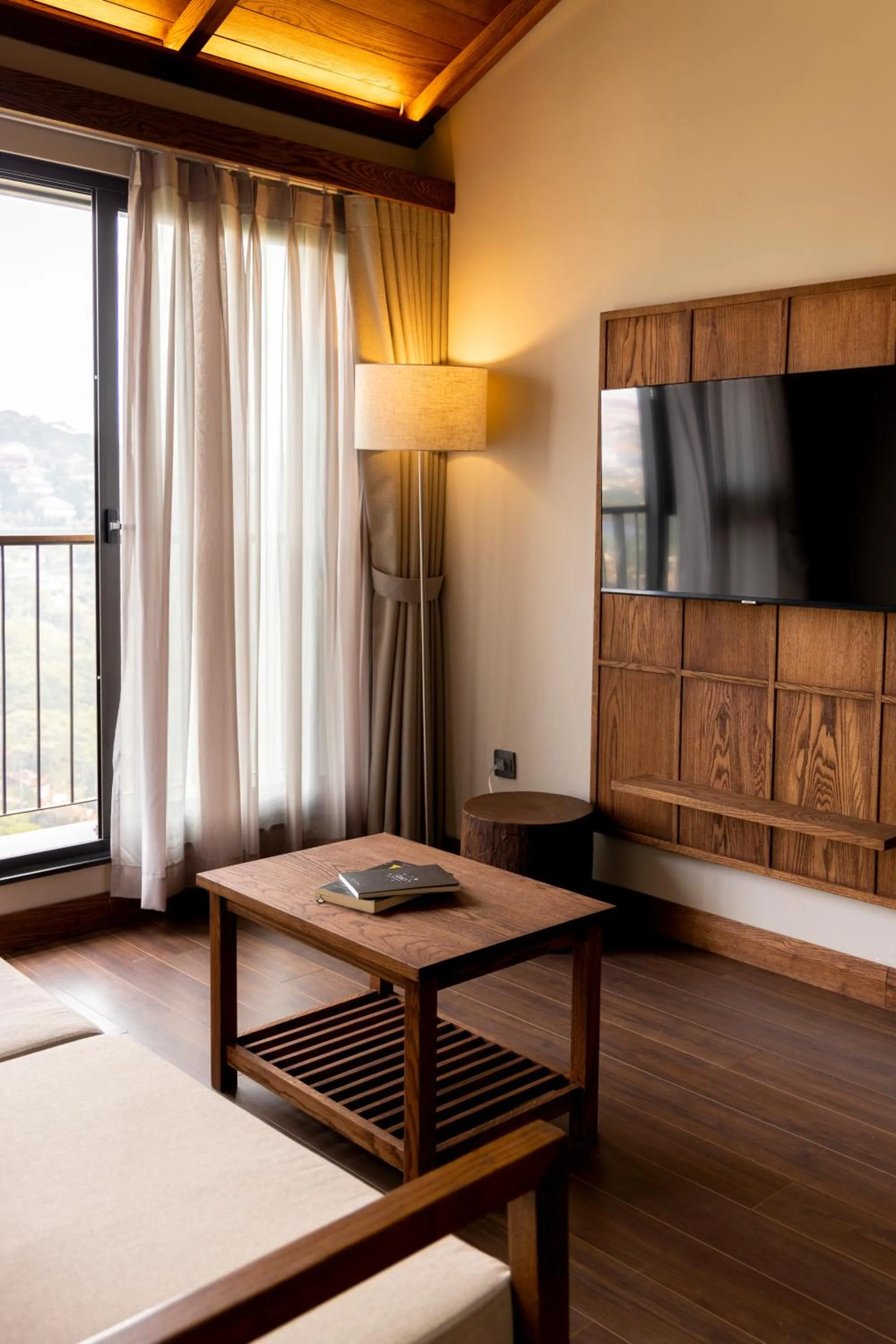 Communal lounge/ TV room, Bed in HLS Dalat Lodge