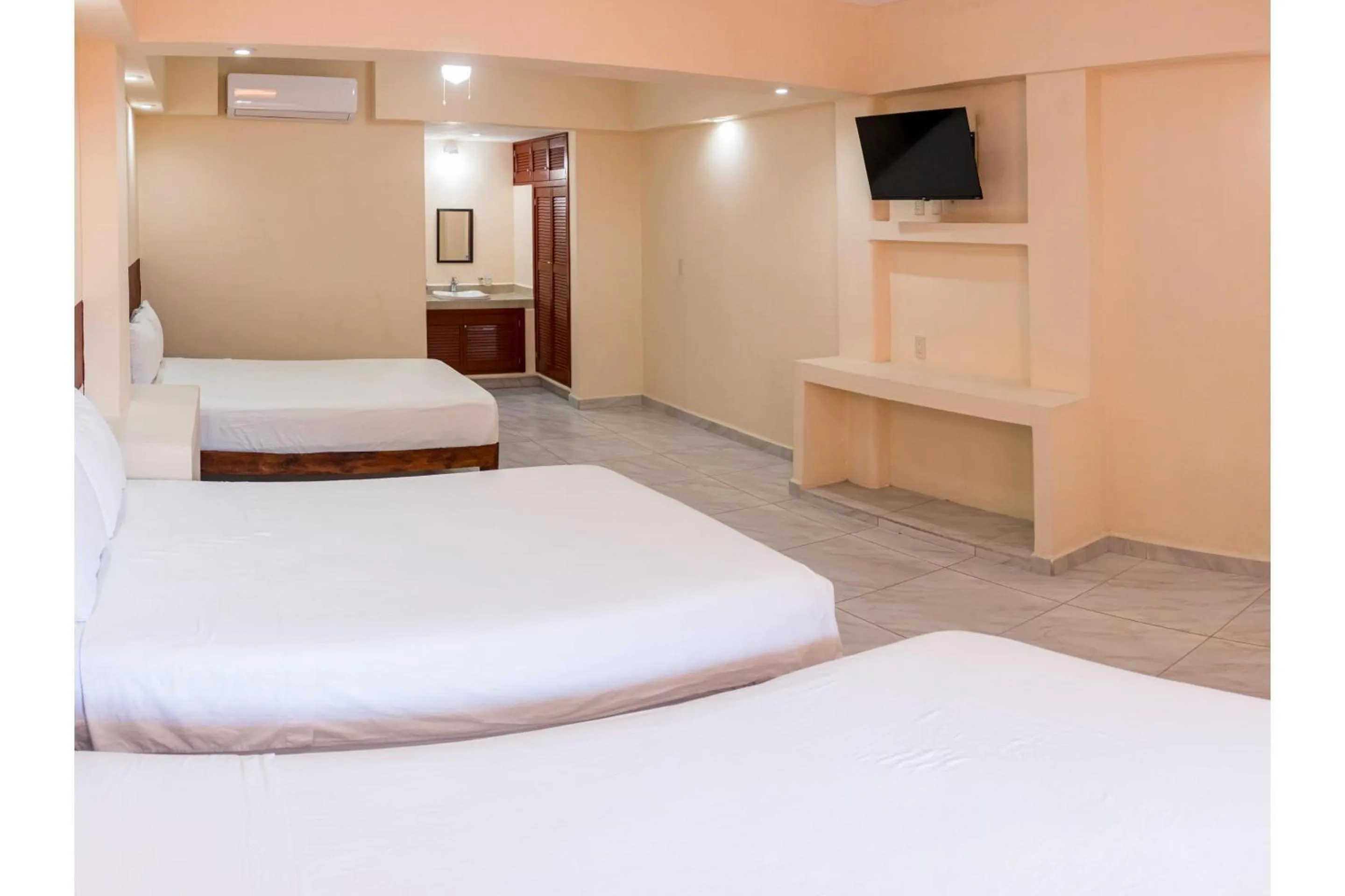 Bedroom, Bed in OYO Hotel La Playa