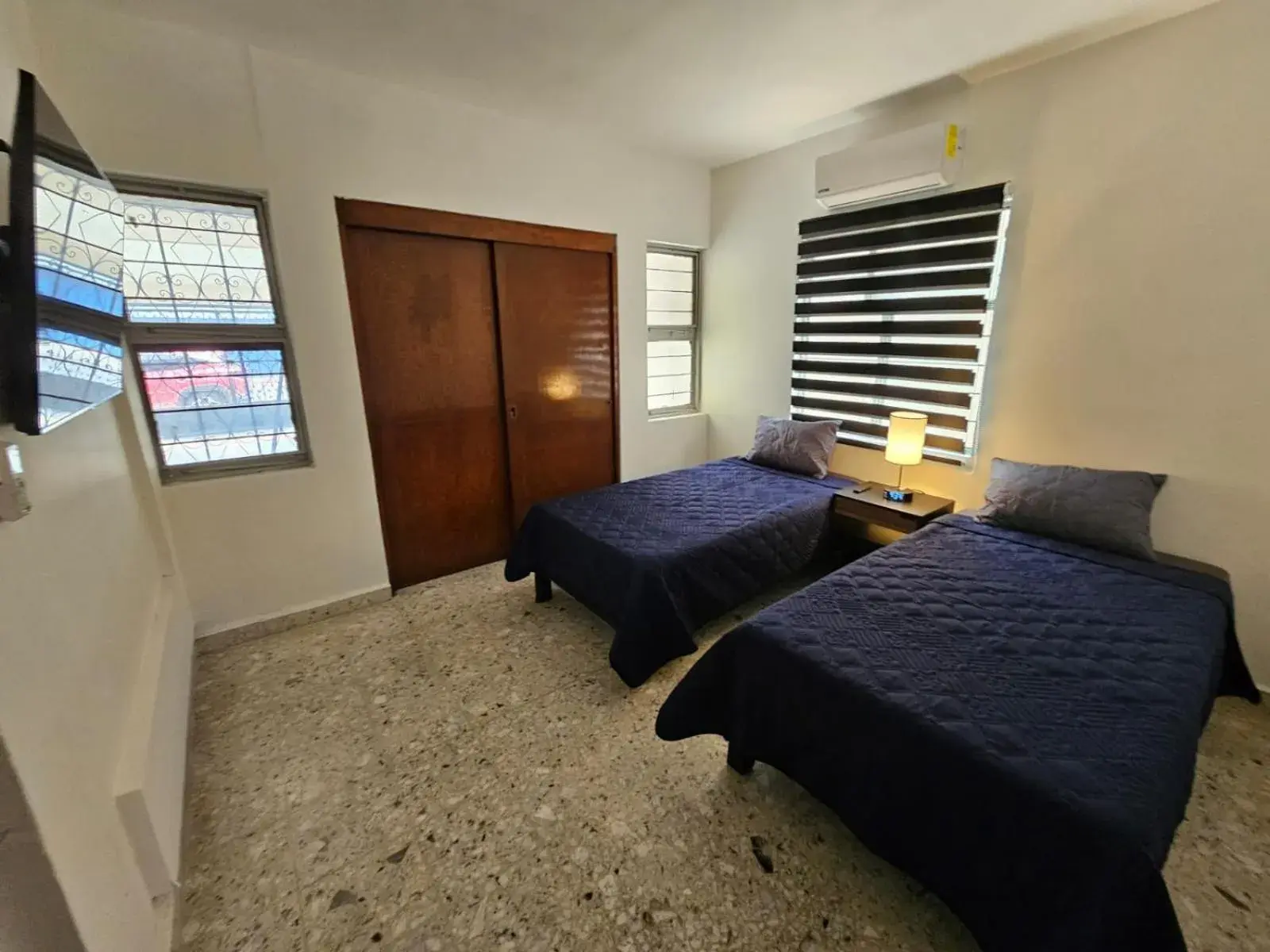 Bed in JESAVI Suites Bed in JESAVI Suites