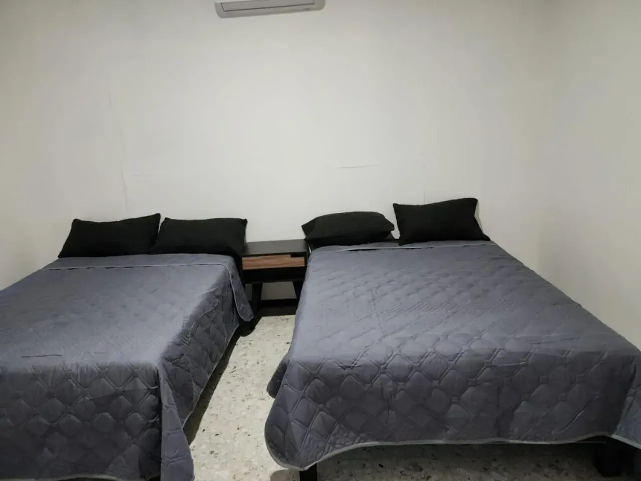 Bed in JESAVI Suites Bed in JESAVI Suites