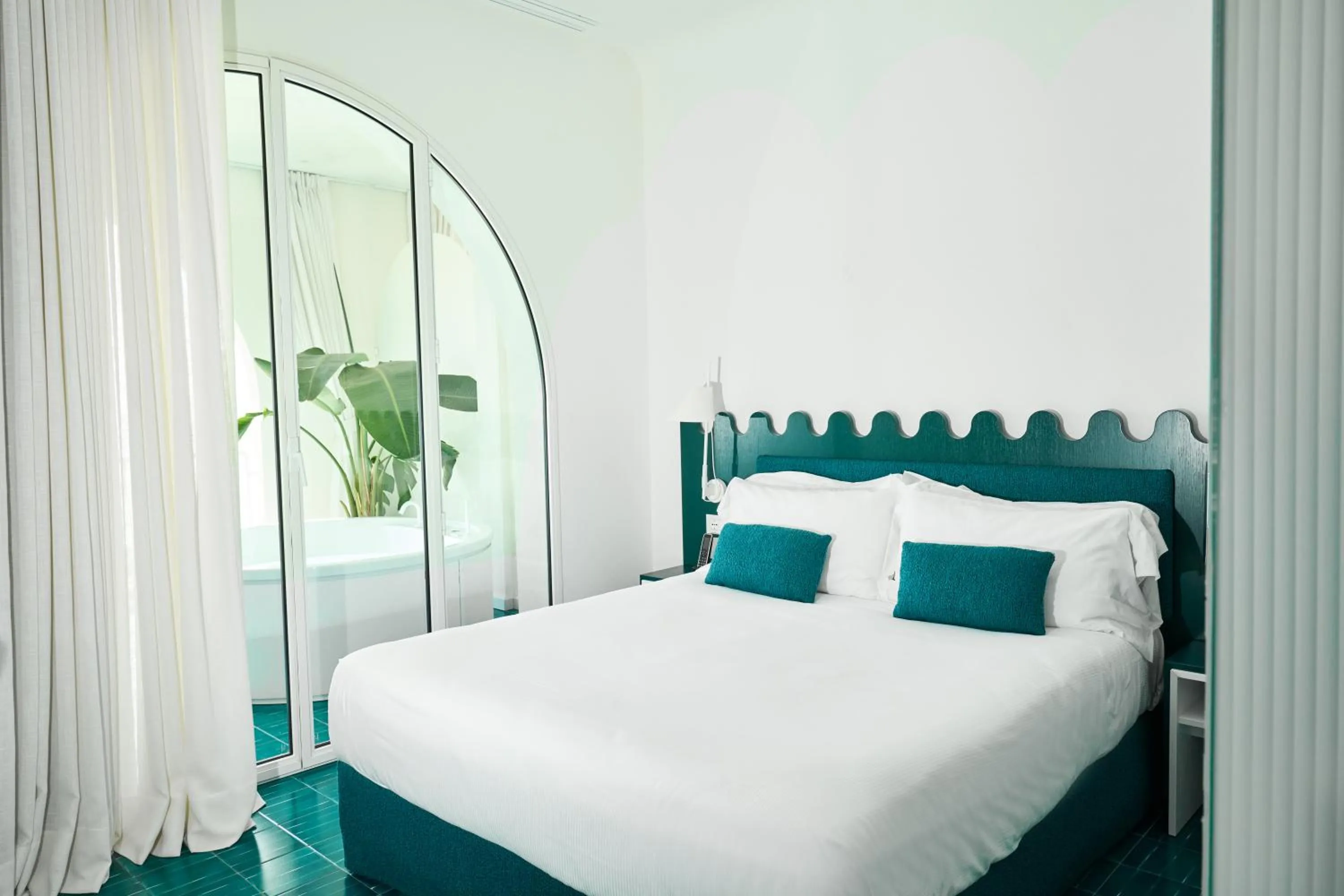 Bed in CALEA Boutique Hotel