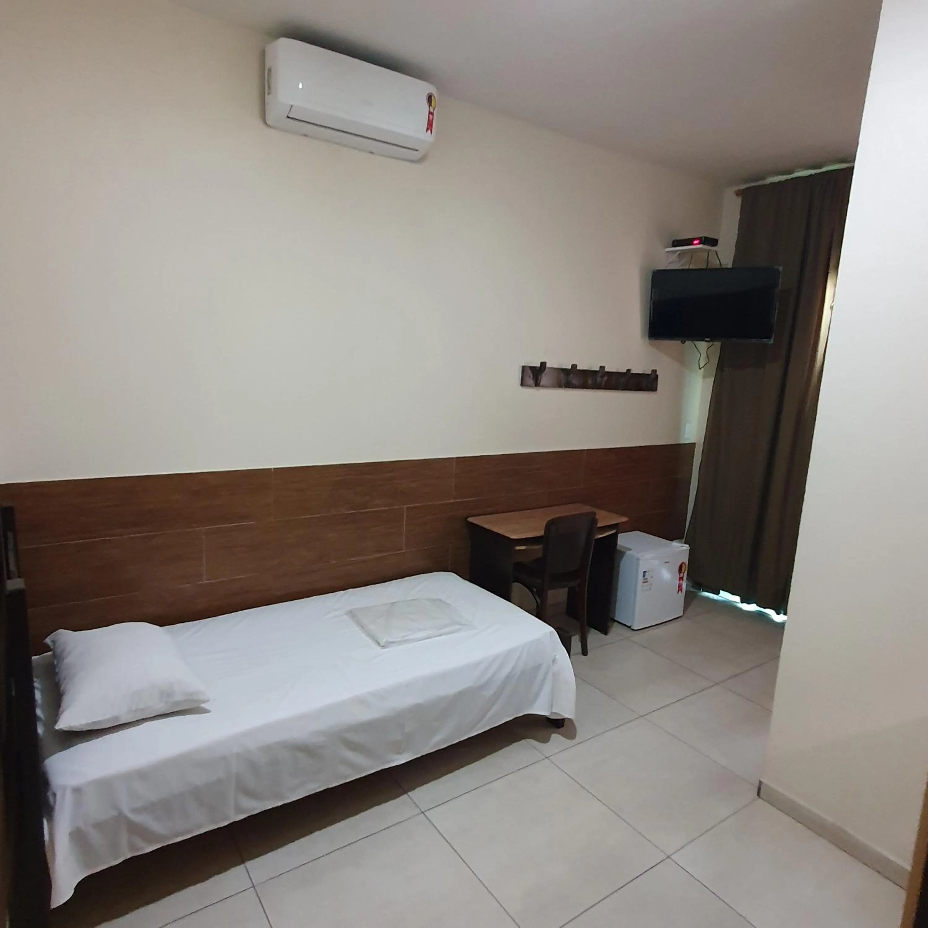 Bed in Hotel Muriaé