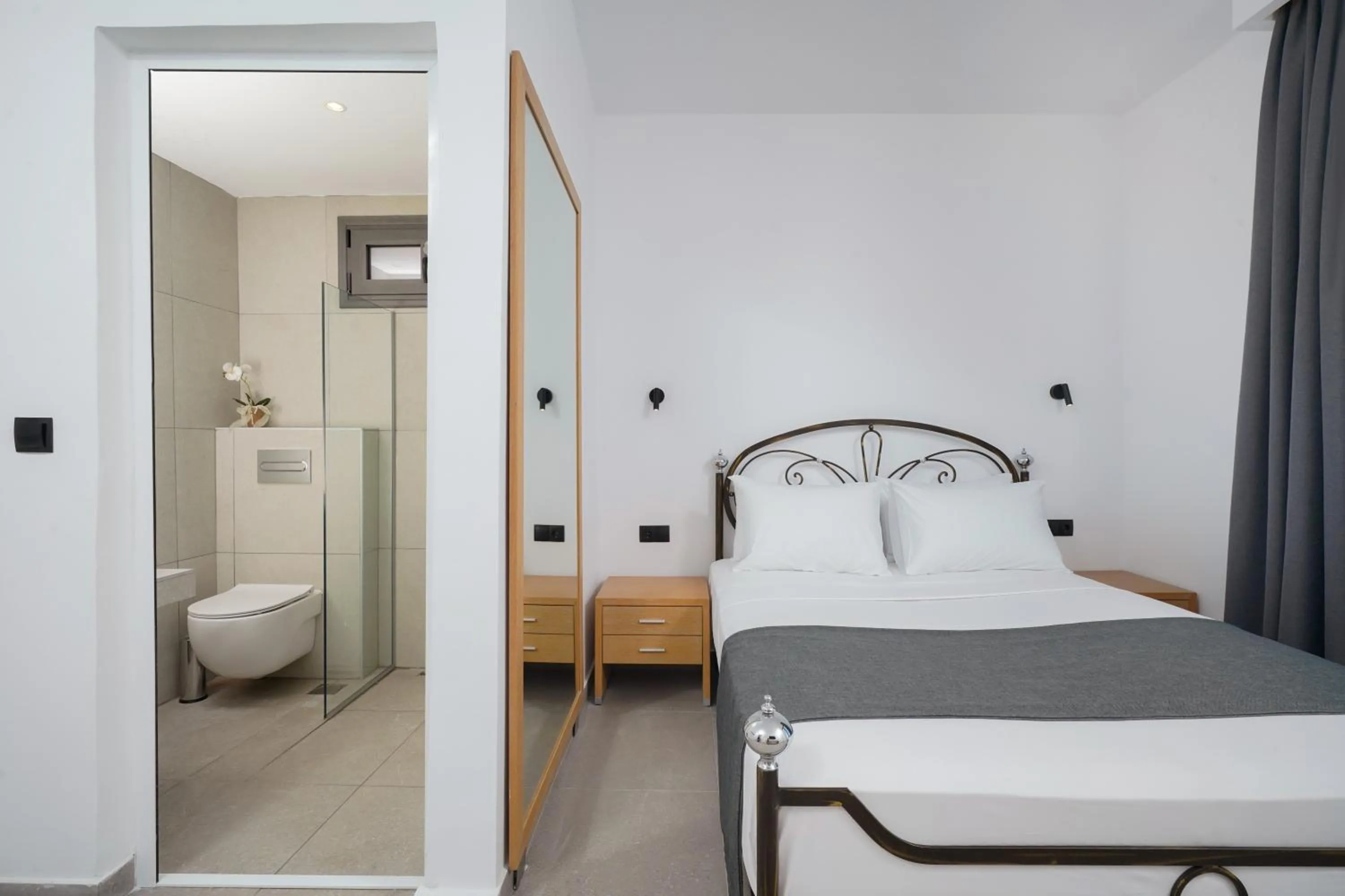 Toilet, Bed in Emerial Deluxe Seaside Rooms
